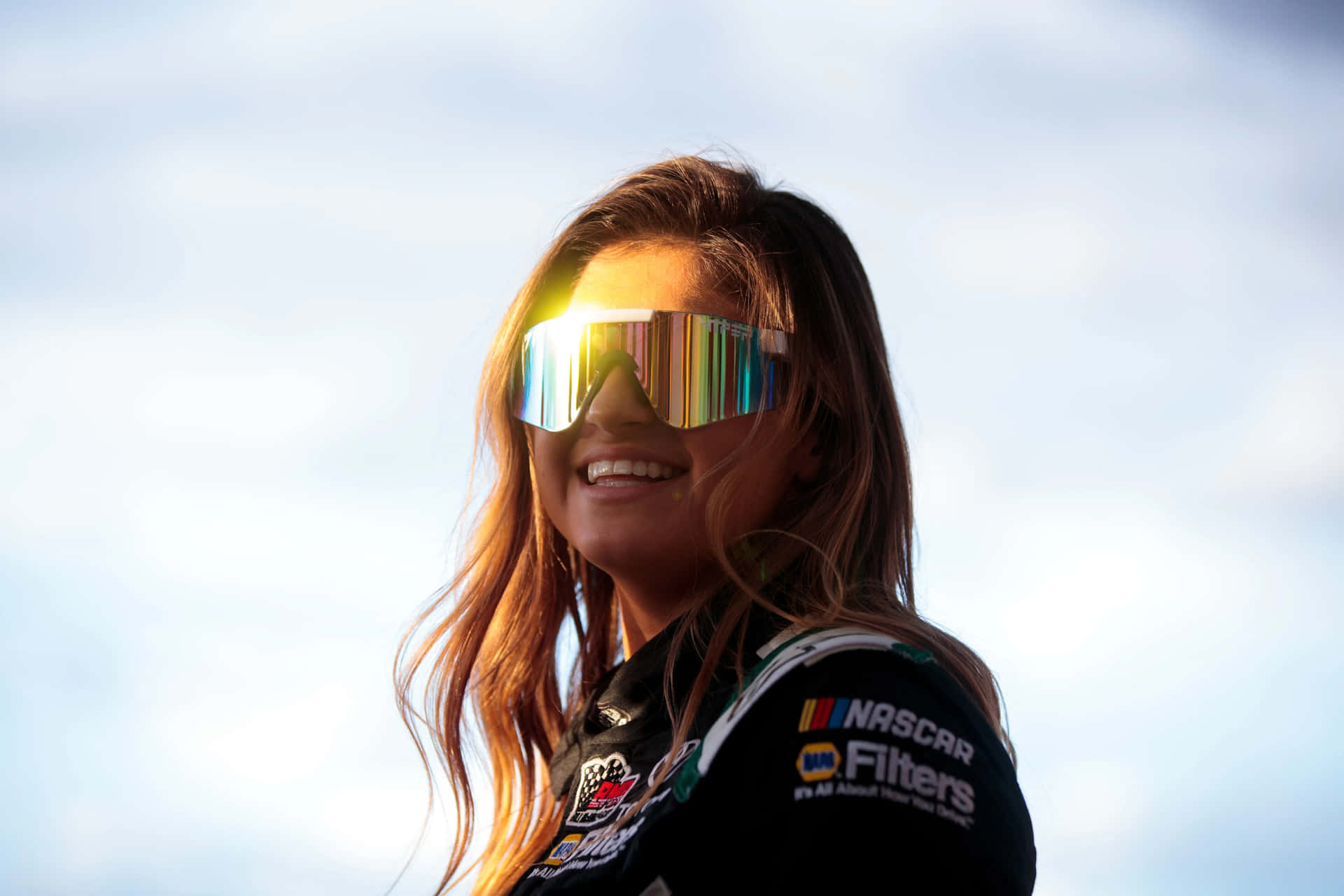 Download Hailie Deegan Sunglasses Smile Wallpaper | Wallpapers.com