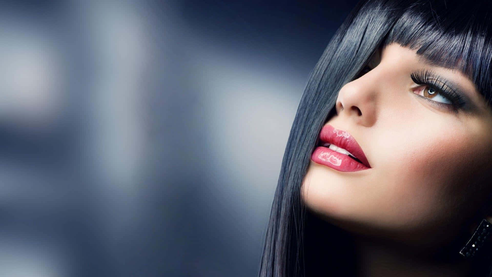 A Woman With Long Black Hair And Black Lipstick