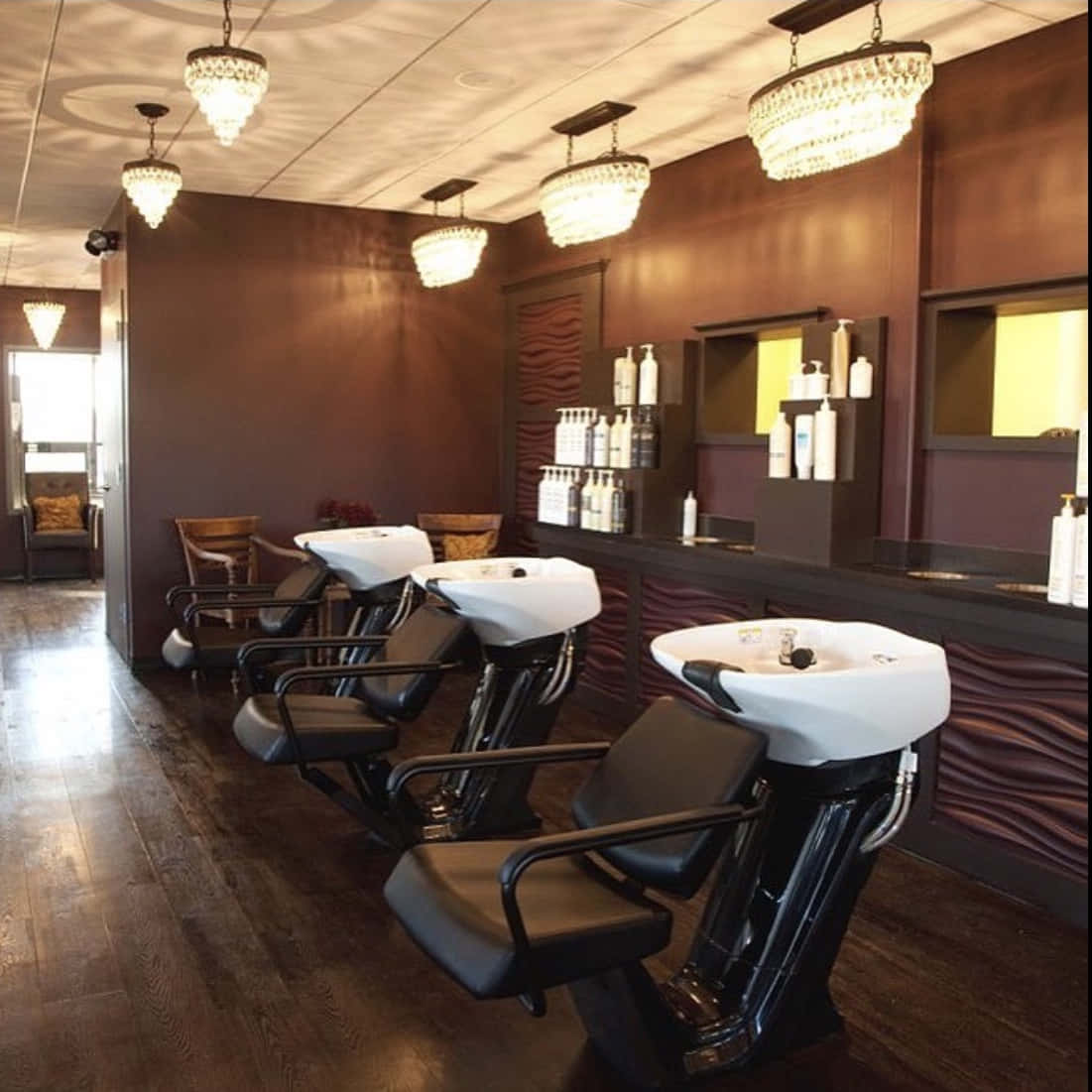 A Salon With Chairs And A Mirror