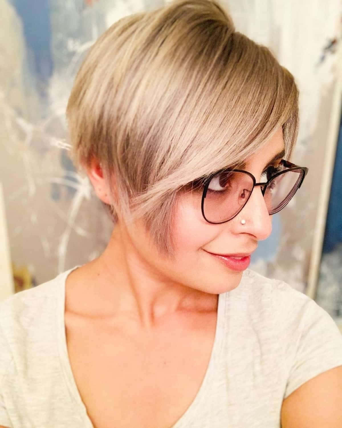 A Woman With Glasses And A Short Pixie Cut