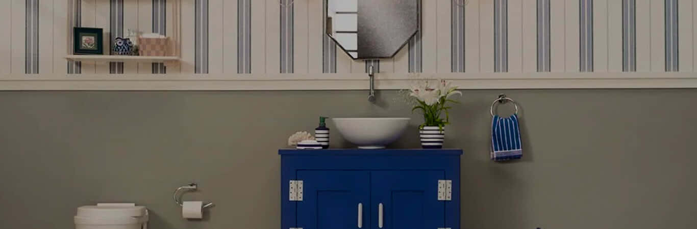 A Bathroom With Blue And White Striped Walls Wallpaper