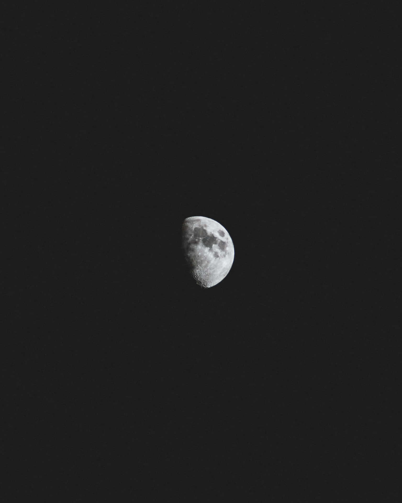 A Black And White Photo Of The Moon Wallpaper