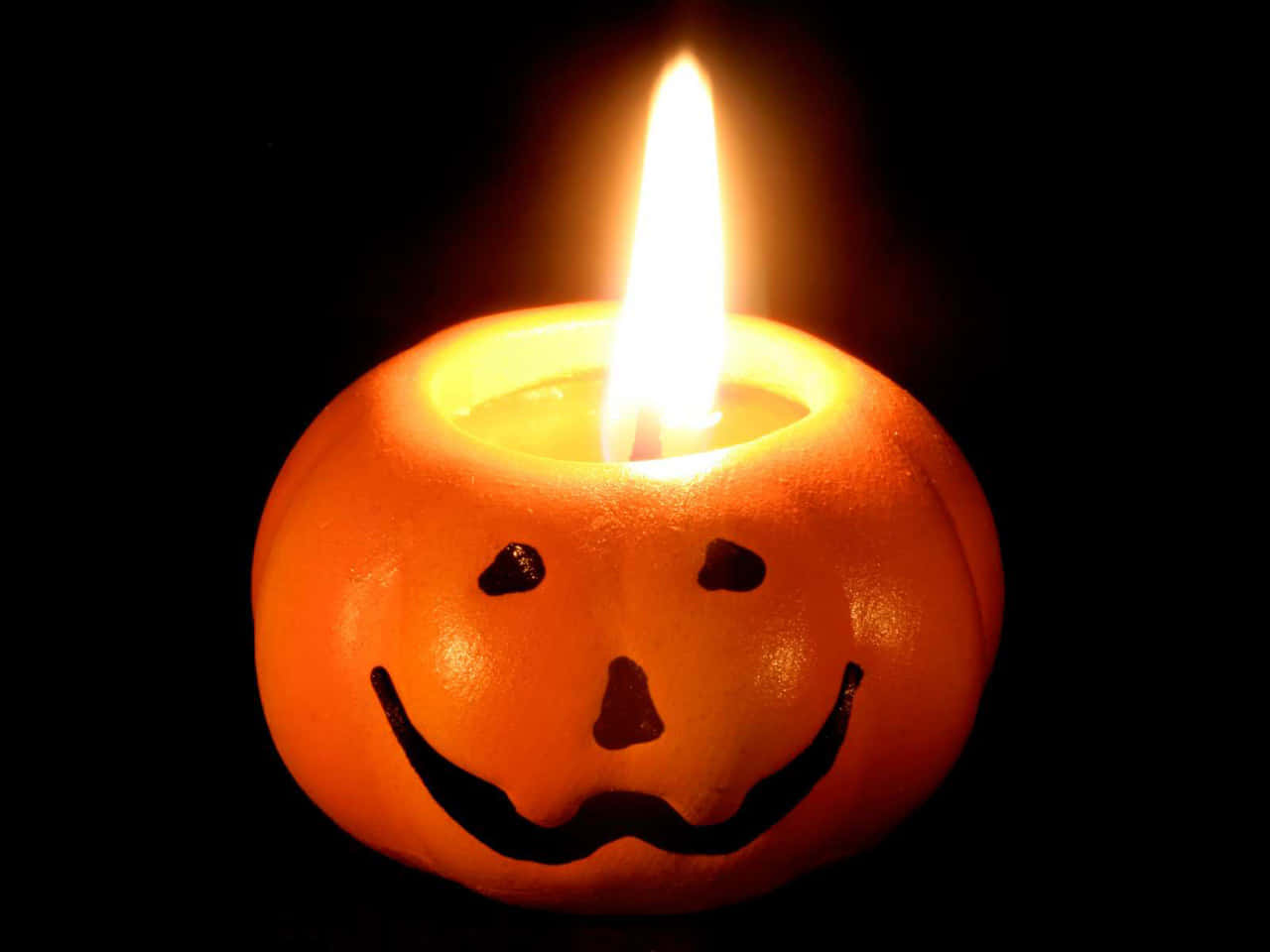 Celebrate Halloween with these eerie and festive candles! Wallpaper