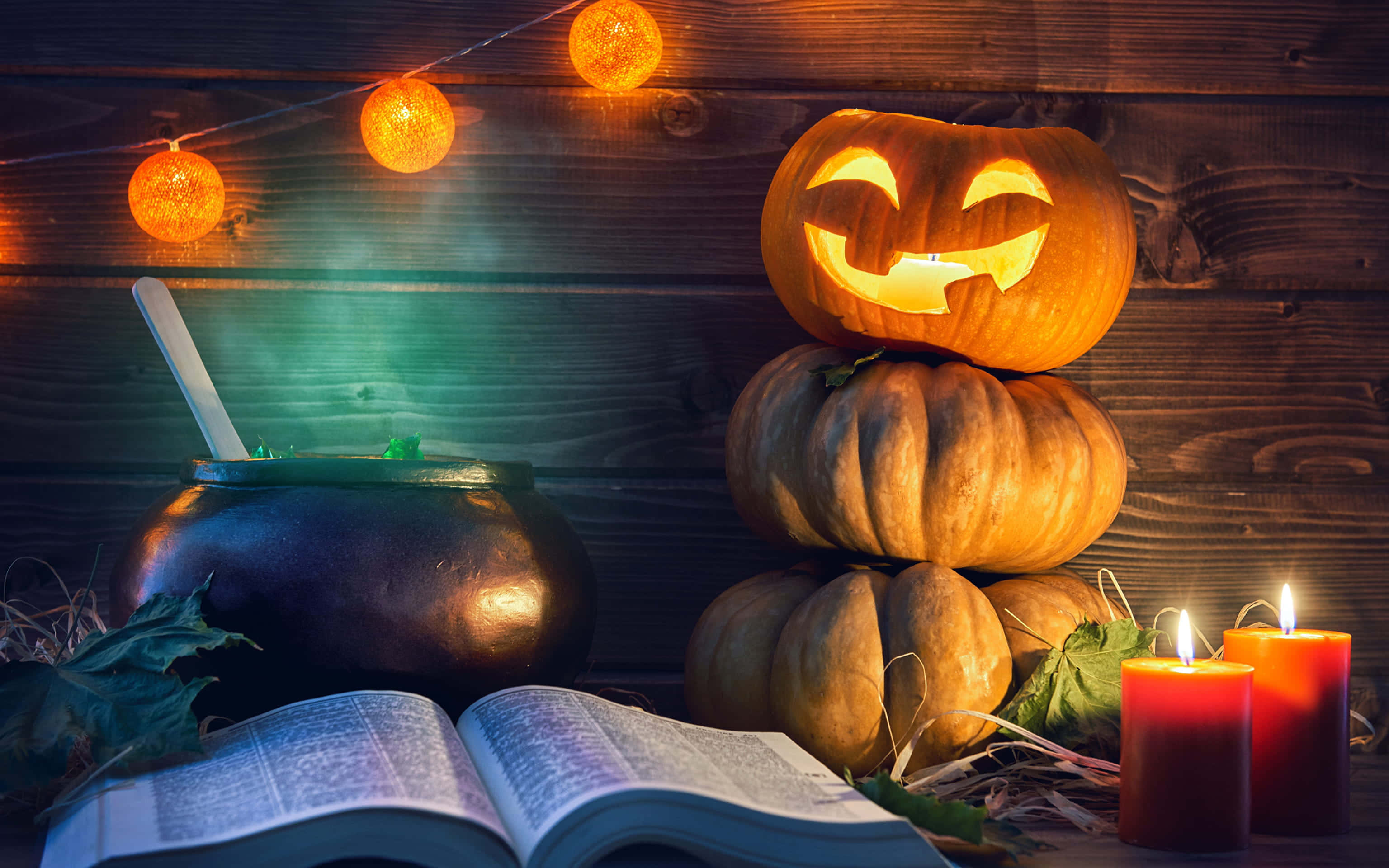 Spooky Halloween Candles Illuminate A Gothic Scene Wallpaper