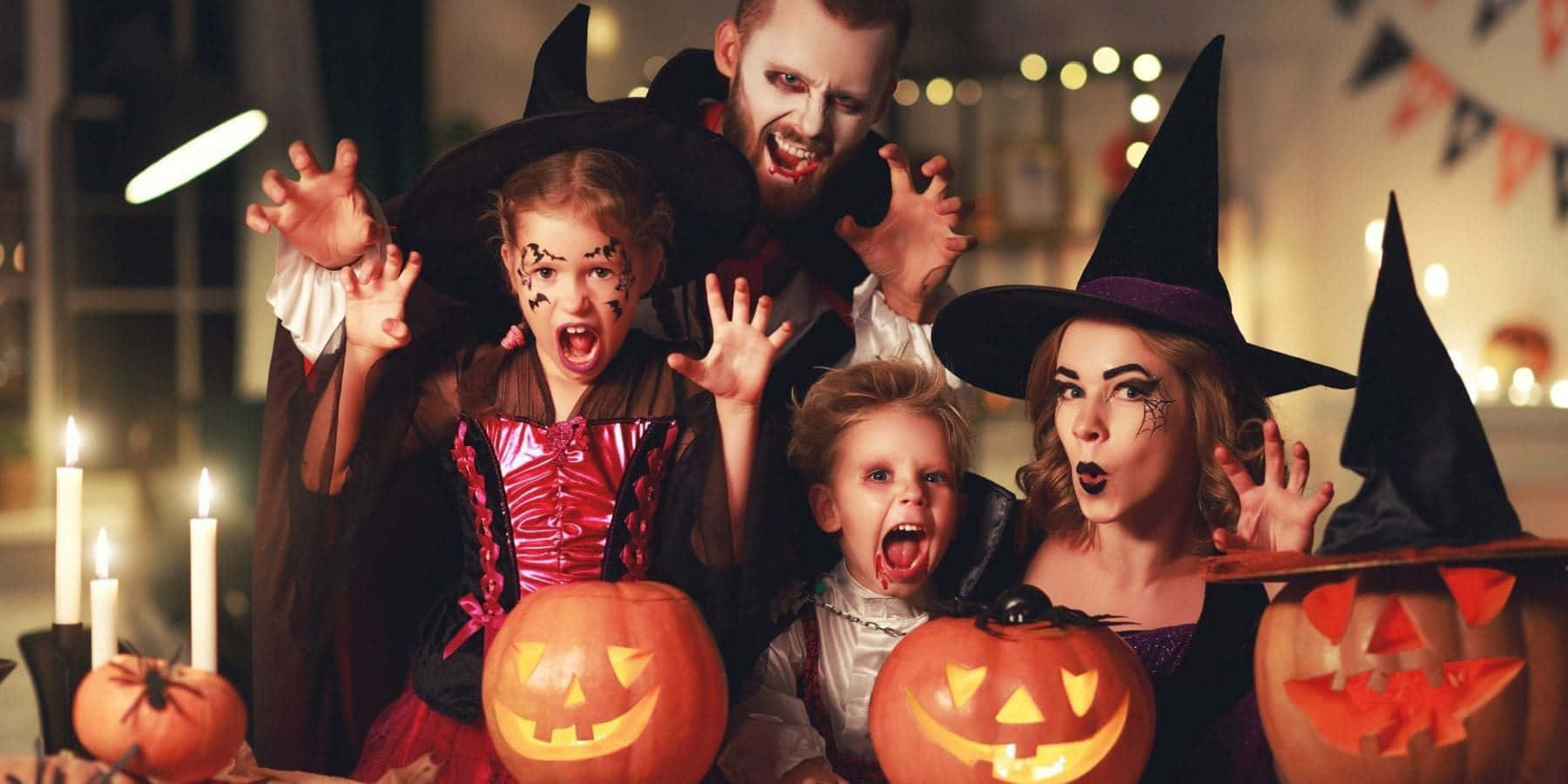 A Family Dressed Up In Halloween Costumes