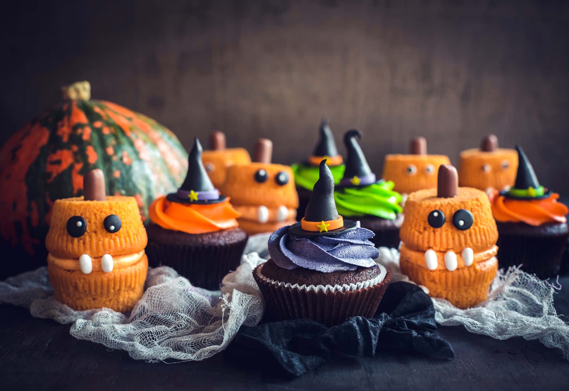 Celebrate this spooky season with these delicious Halloween Cupcakes Wallpaper