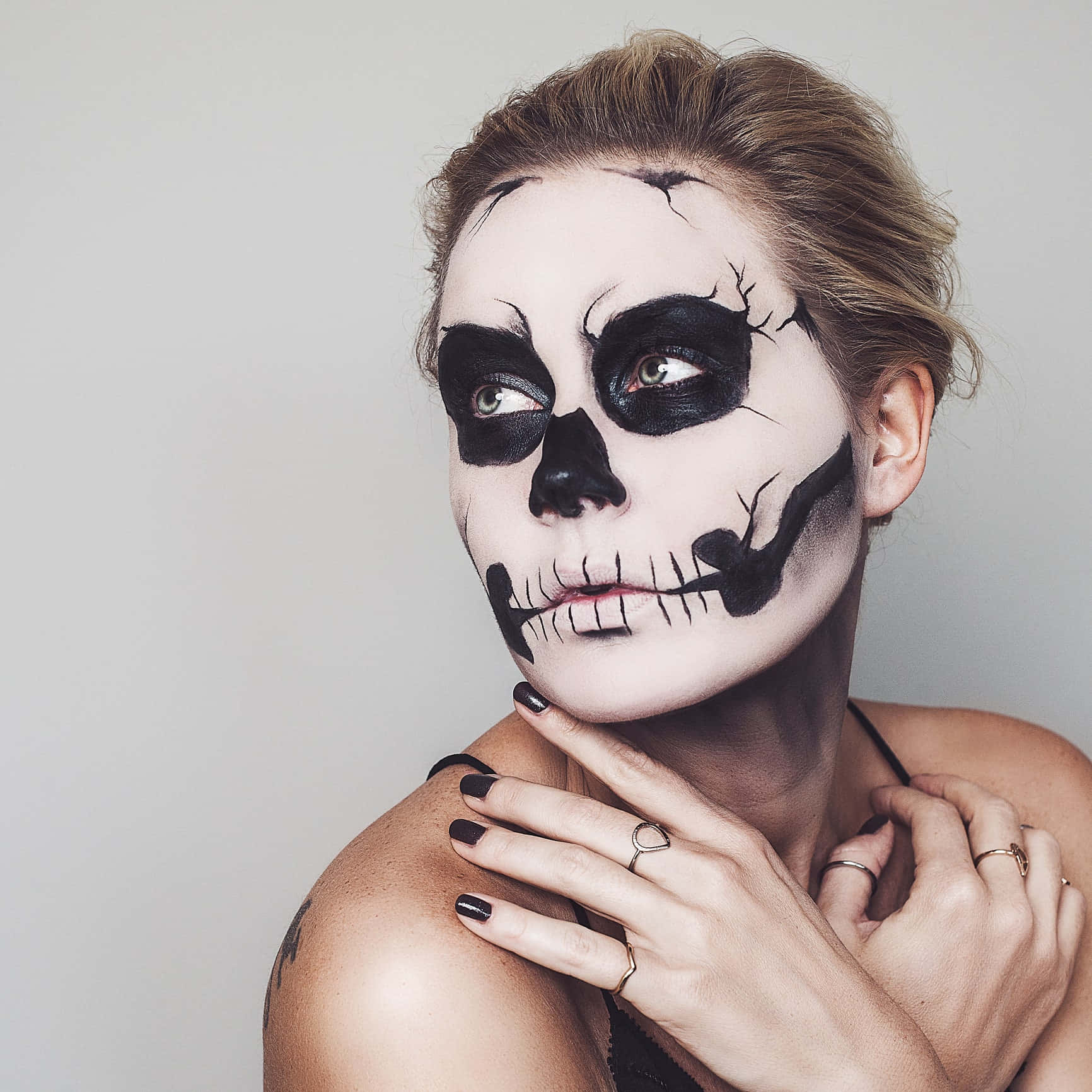 Bring Out Your Spooky Side with Halloween Face Paint" Wallpaper
