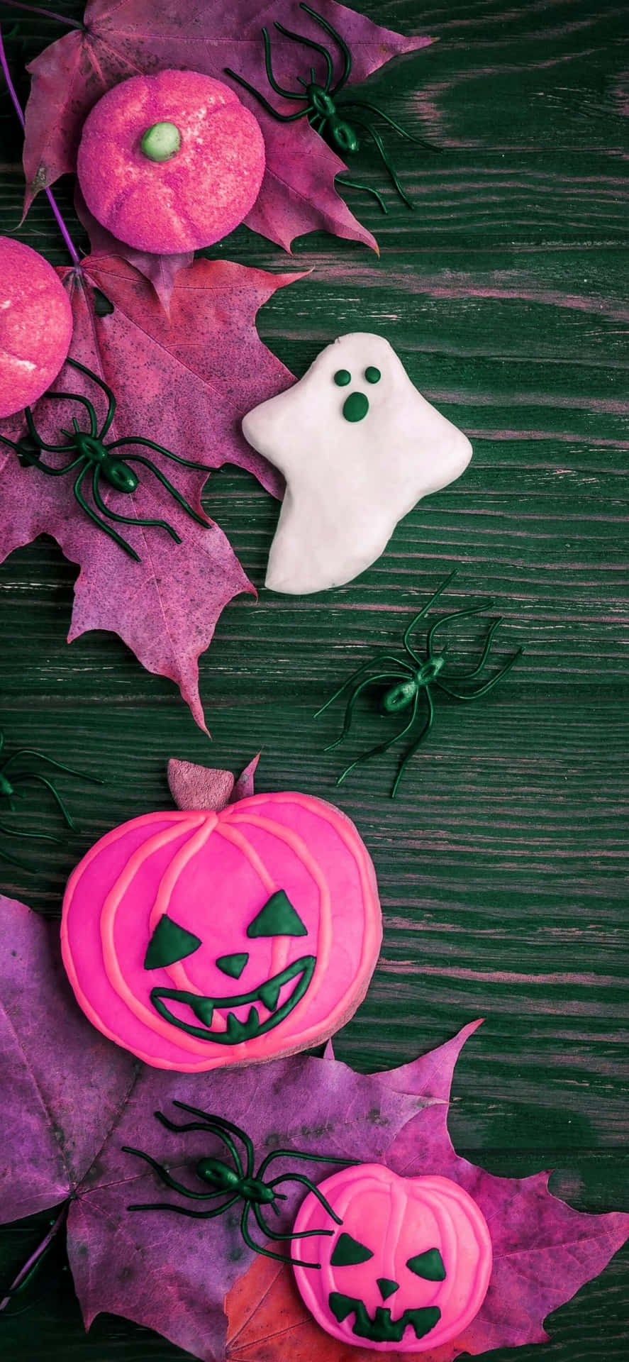 Halloween Cookies And Pumpkins On A Dark Wooden Table