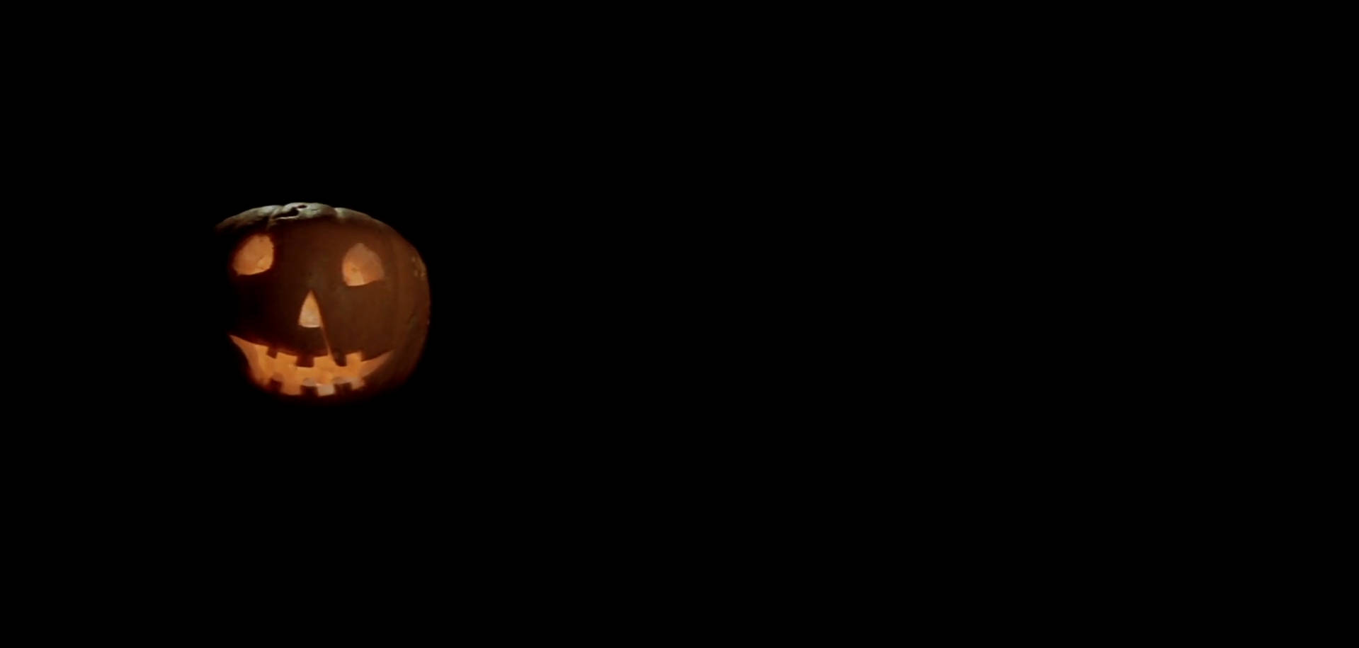 Njutav Halloween-högtiden Med Denna Läskiga Jack O'lantern Som Bakgrundsbild Till Din Dator Eller Mobil. Wallpaper