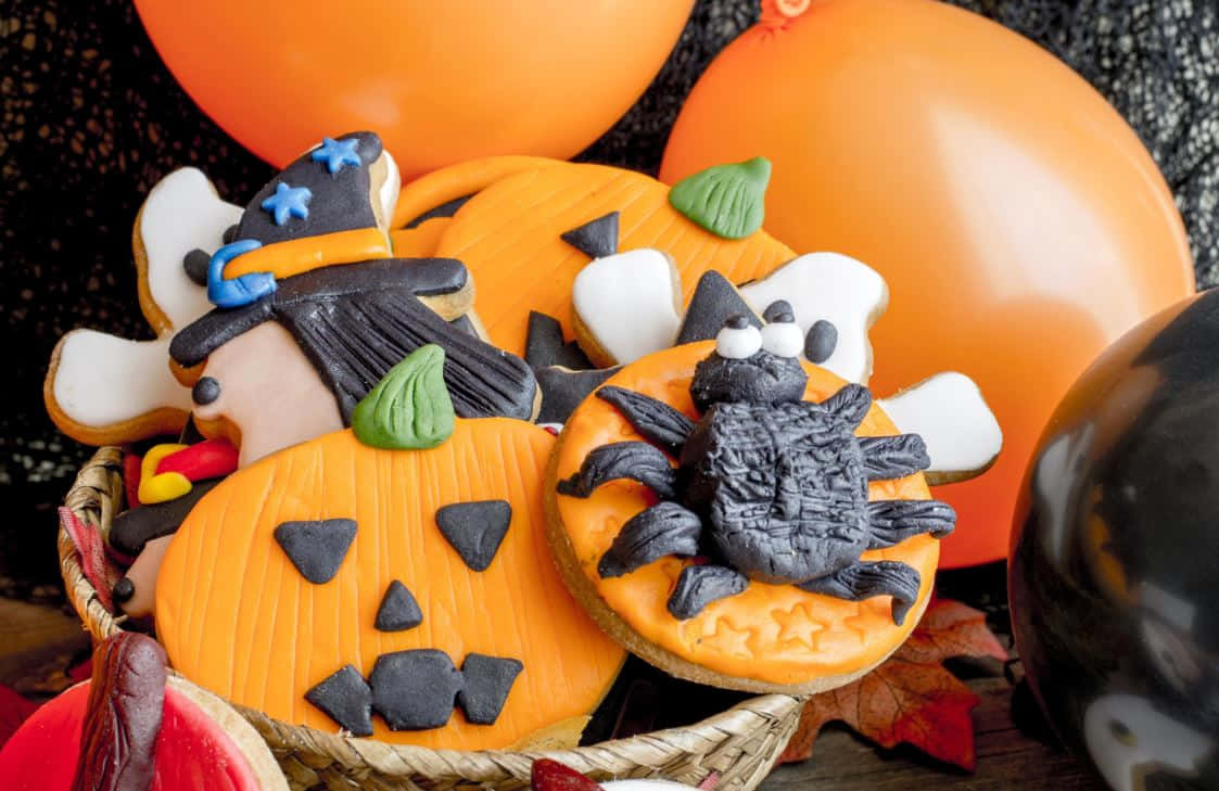 Sweet Halloween Treats Fill Your Table Wallpaper