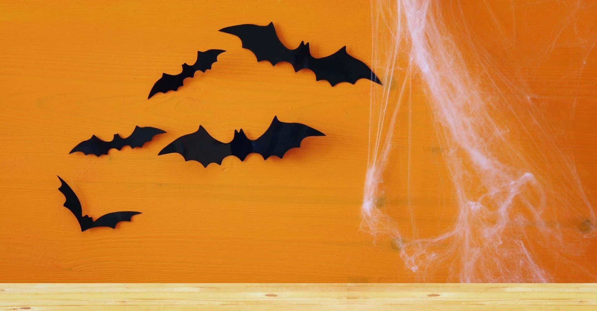 Bats On Orange Wall Halloween Zoom Background 1915 x 998 Background