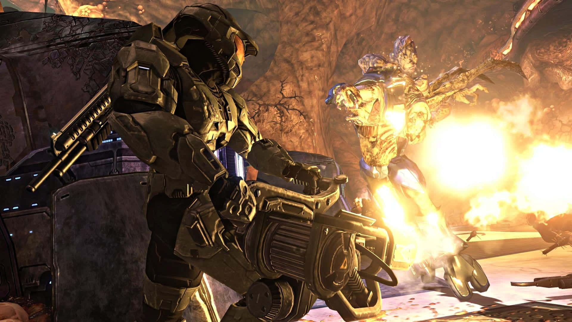 Intensaescena De Batalla, Que Muestra A Un Soldado Espartano Luchando Contra El Flood En Halo. Fondo de pantalla