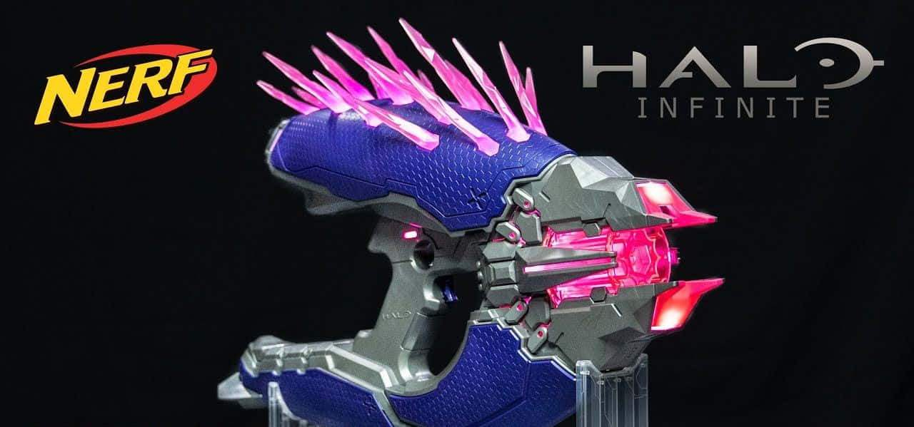 Intense Combat with the Iconic Halo Needler Weapon Wallpaper