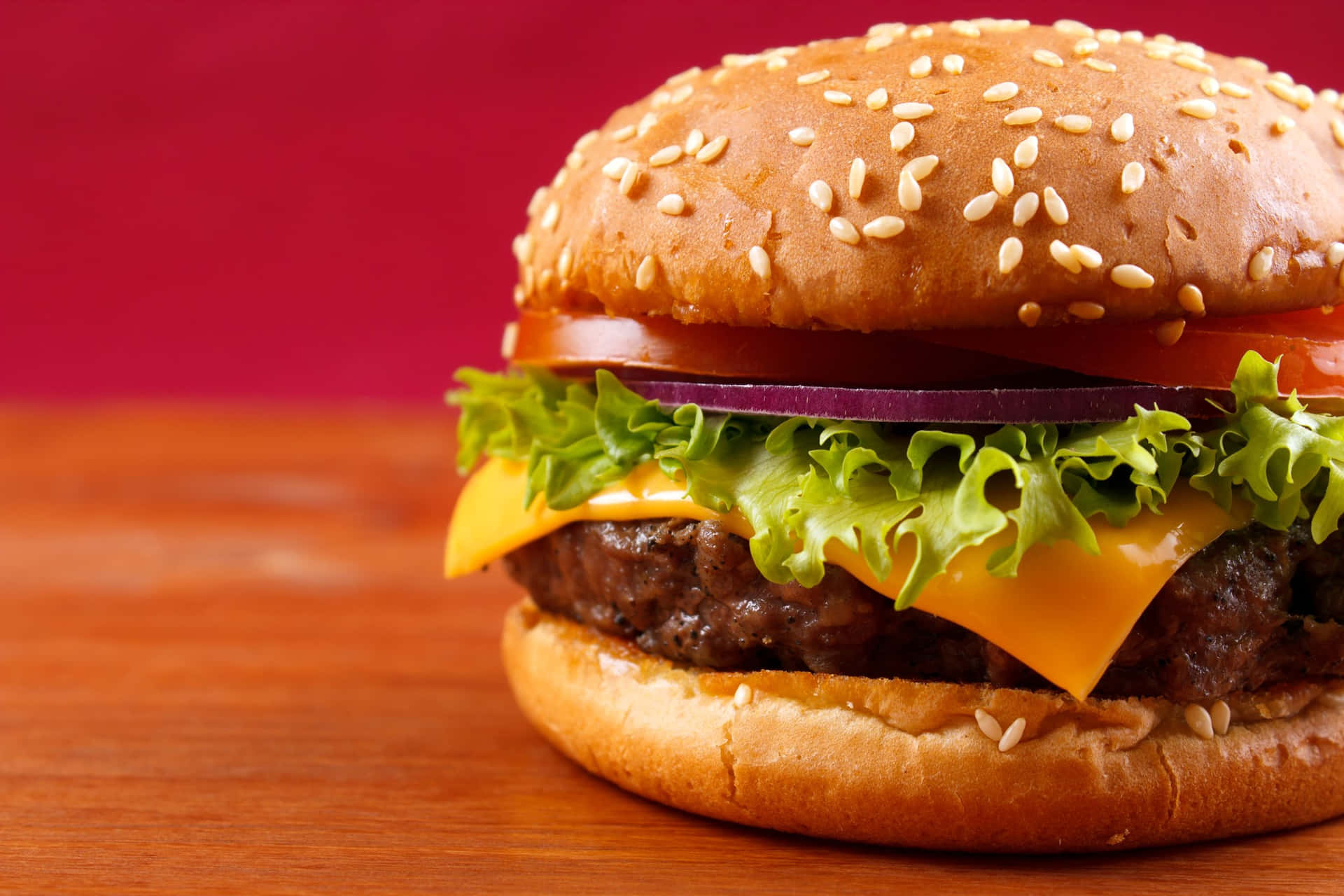 A Hamburger With Cheese And Lettuce