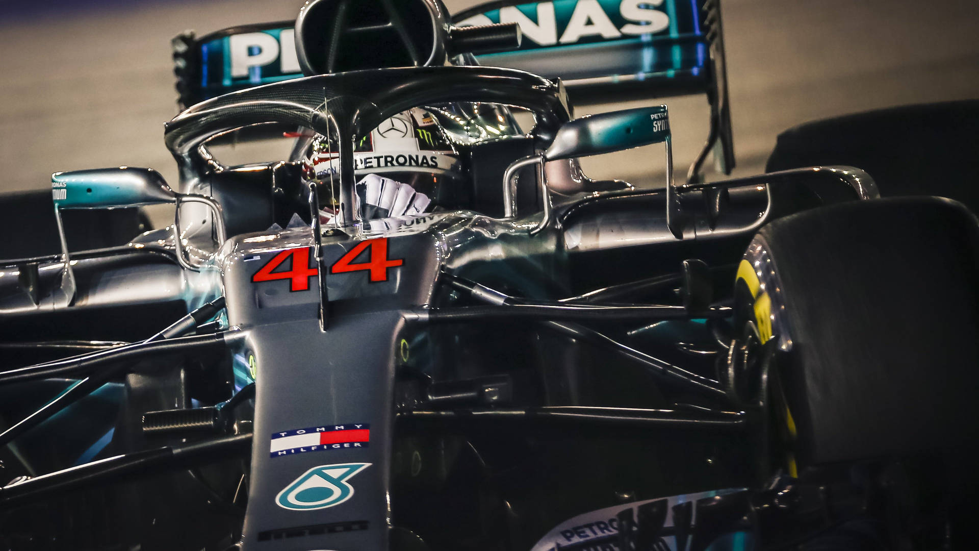 A Mercedes F1 Car With Number 44 On It Wallpaper