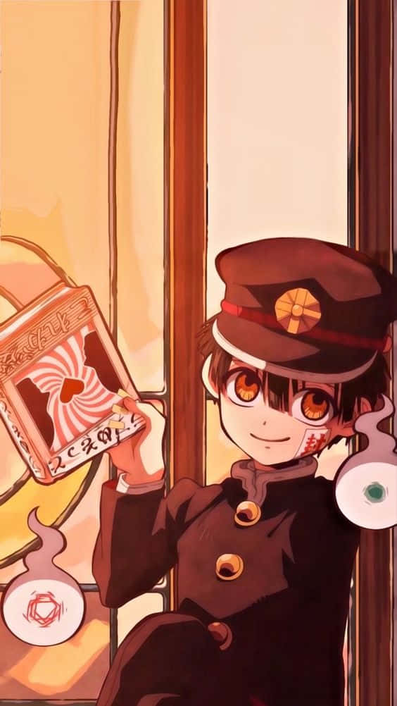 A Boy In A Uniform Holding A Book