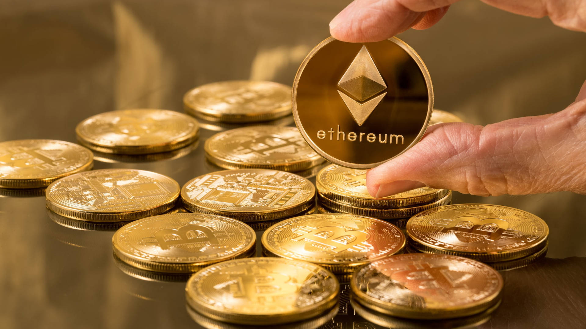 Hand Holding Ethereum  Gold Coin Wallpaper