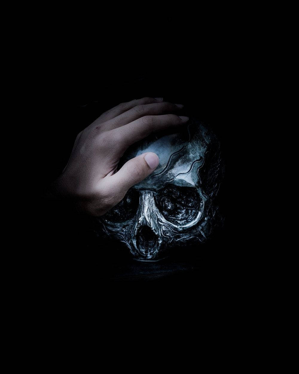 Download Hand On Skull Black Horror Wallpaper | Wallpapers.com