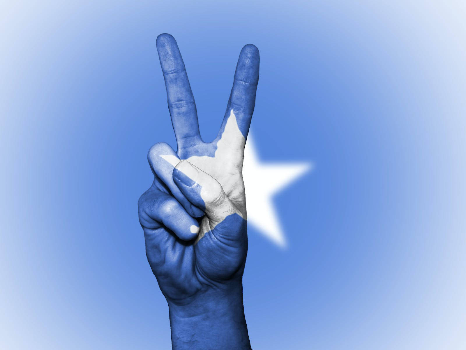 Friedenssymbolder Hand Auf Somalischer Flagge Wallpaper