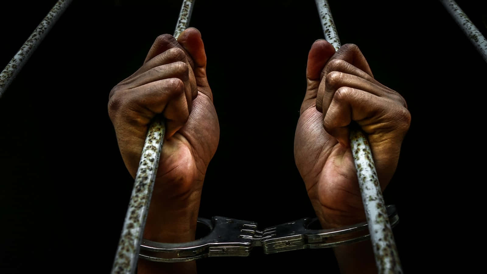Handcuffed In Prison Wallpaper