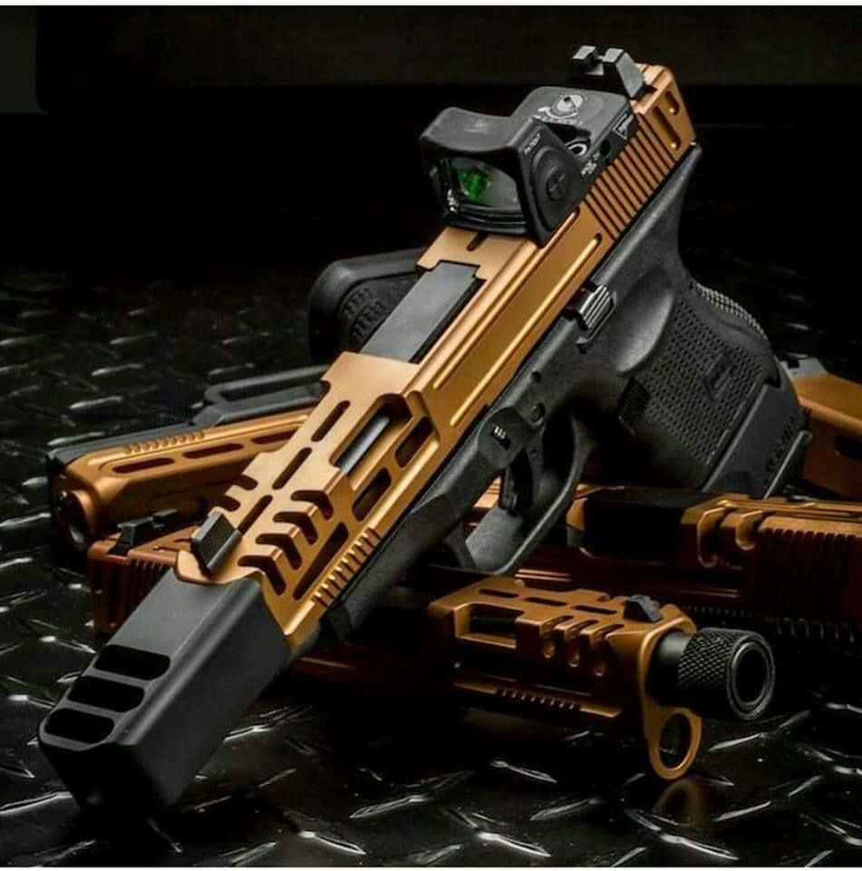 Black And Gold Handgun With Scope Picture