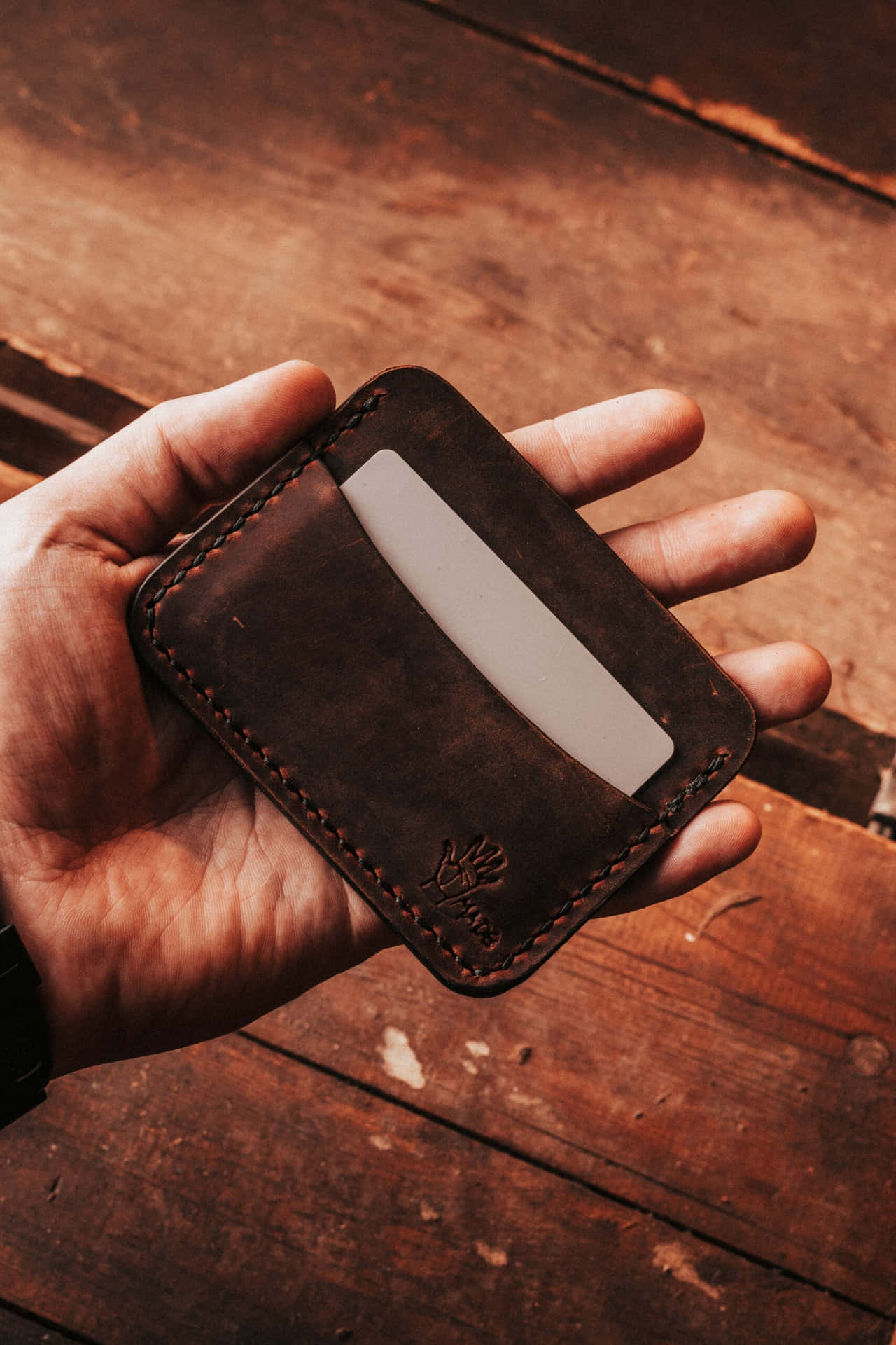 Handheld Leather Card Wallet Wallpaper