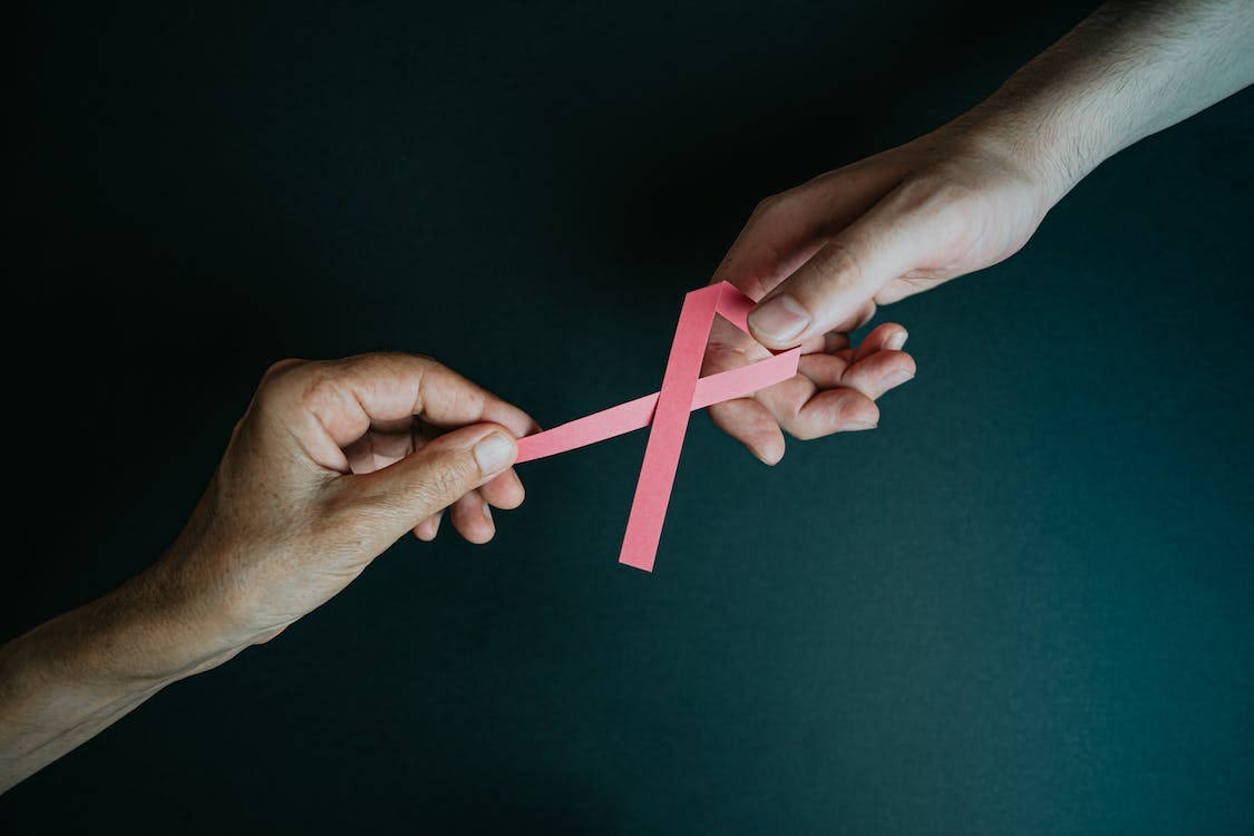 Hands Holding Ribbon Breast Cancer Awareness Wallpaper