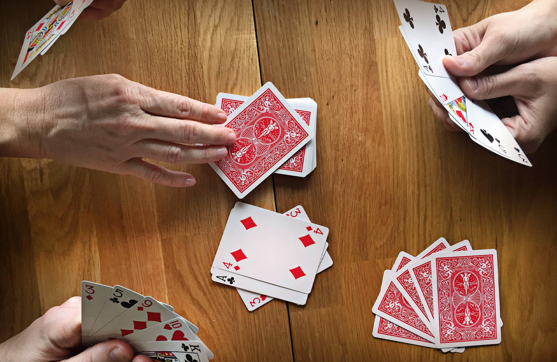 Hands Playing Rummy Game Wallpaper