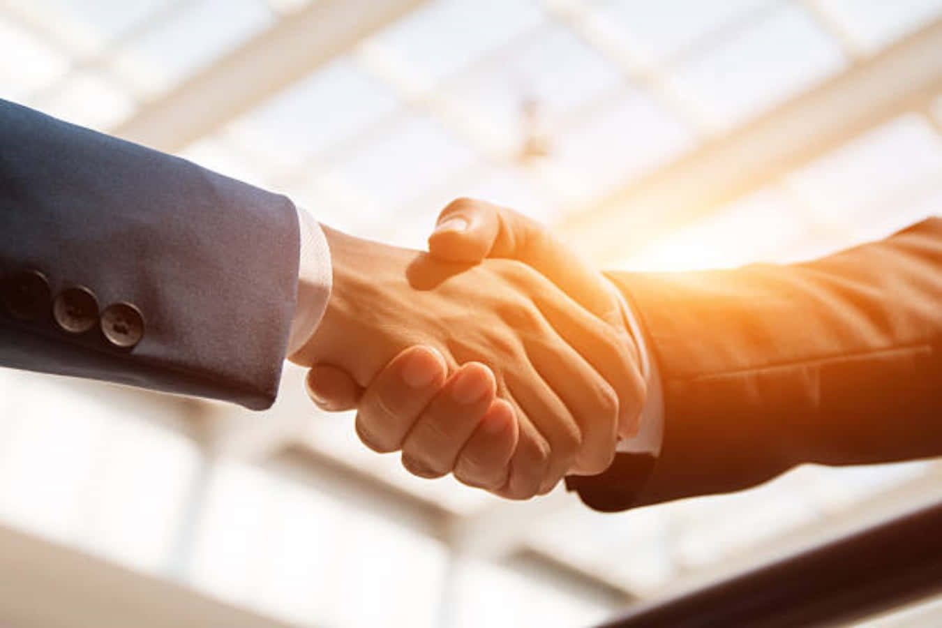 Businessmen Handshake With Sunset Light Picture