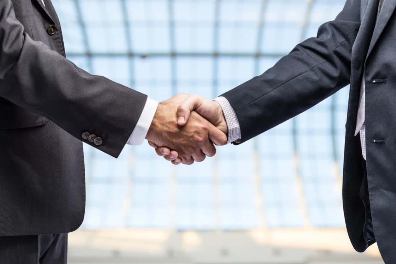 Businessmen Handshake In Glass Wall Picture