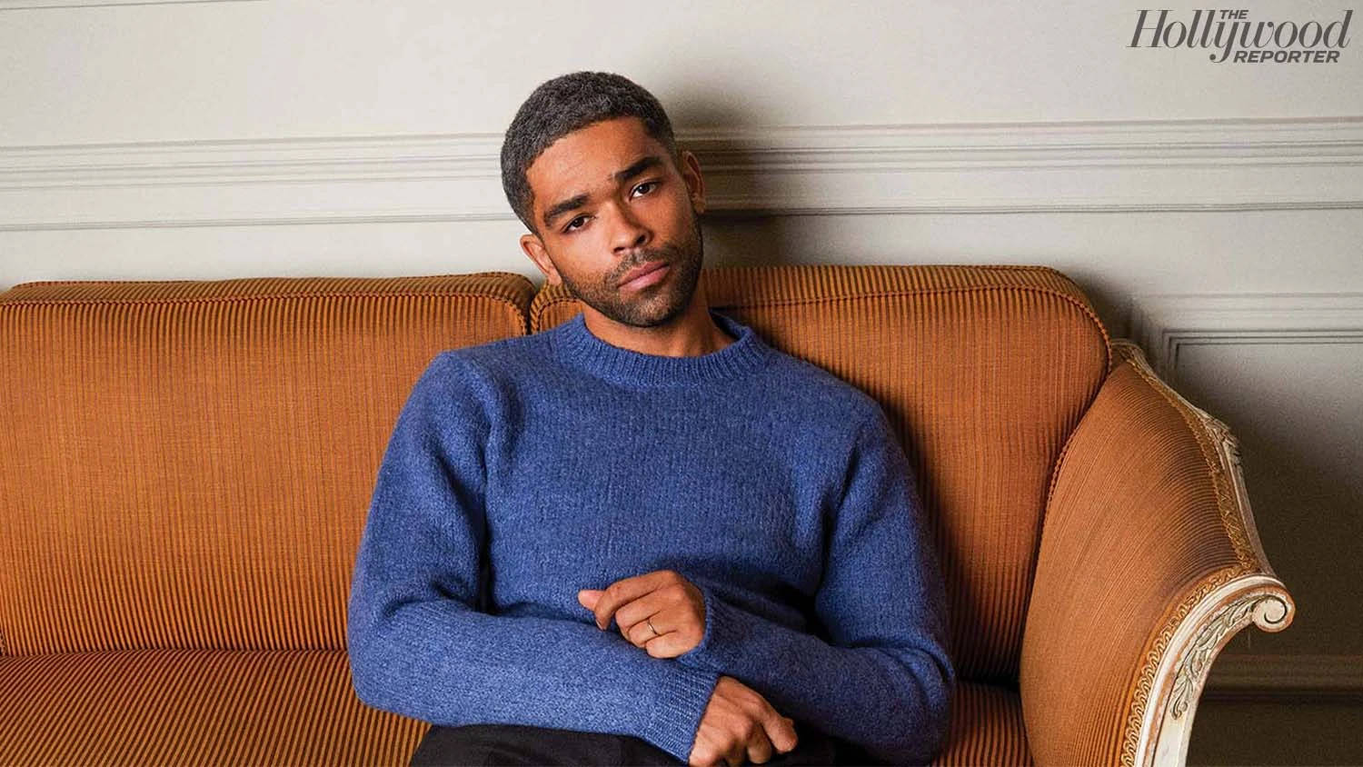 Handsome Black Man Blue Sweater Wallpaper