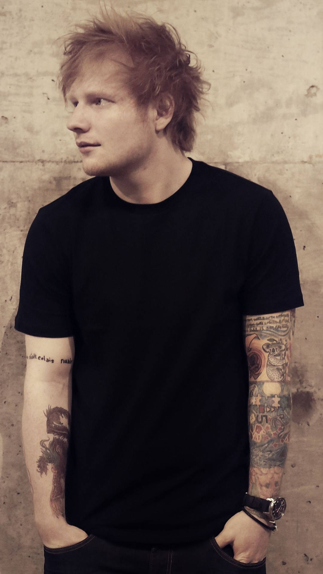 Ed Sheeran looks dashing in a classic white shirt. Wallpaper