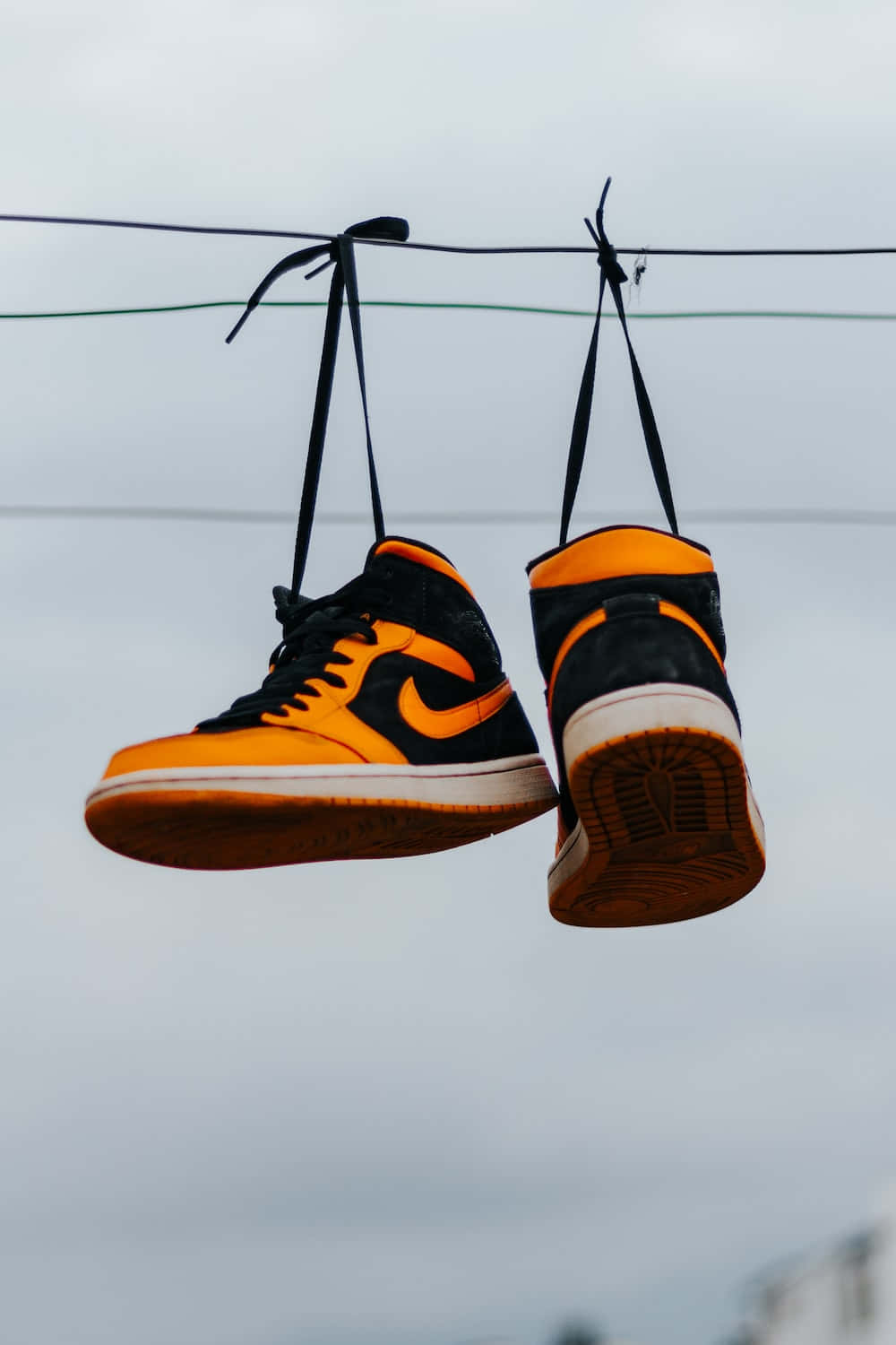 Hanging Basketball Shoes Overhead Wallpaper