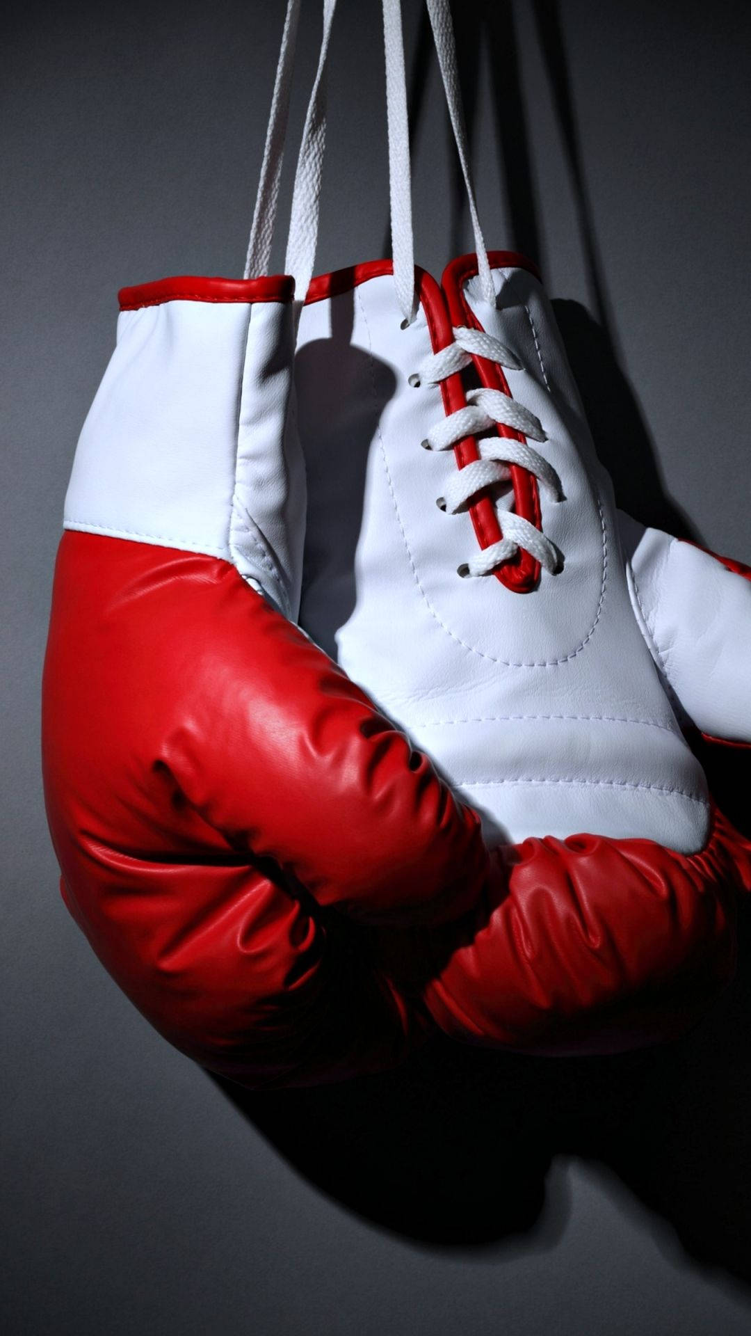 Download Hanging White Red Boxing Gloves Wallpaper 