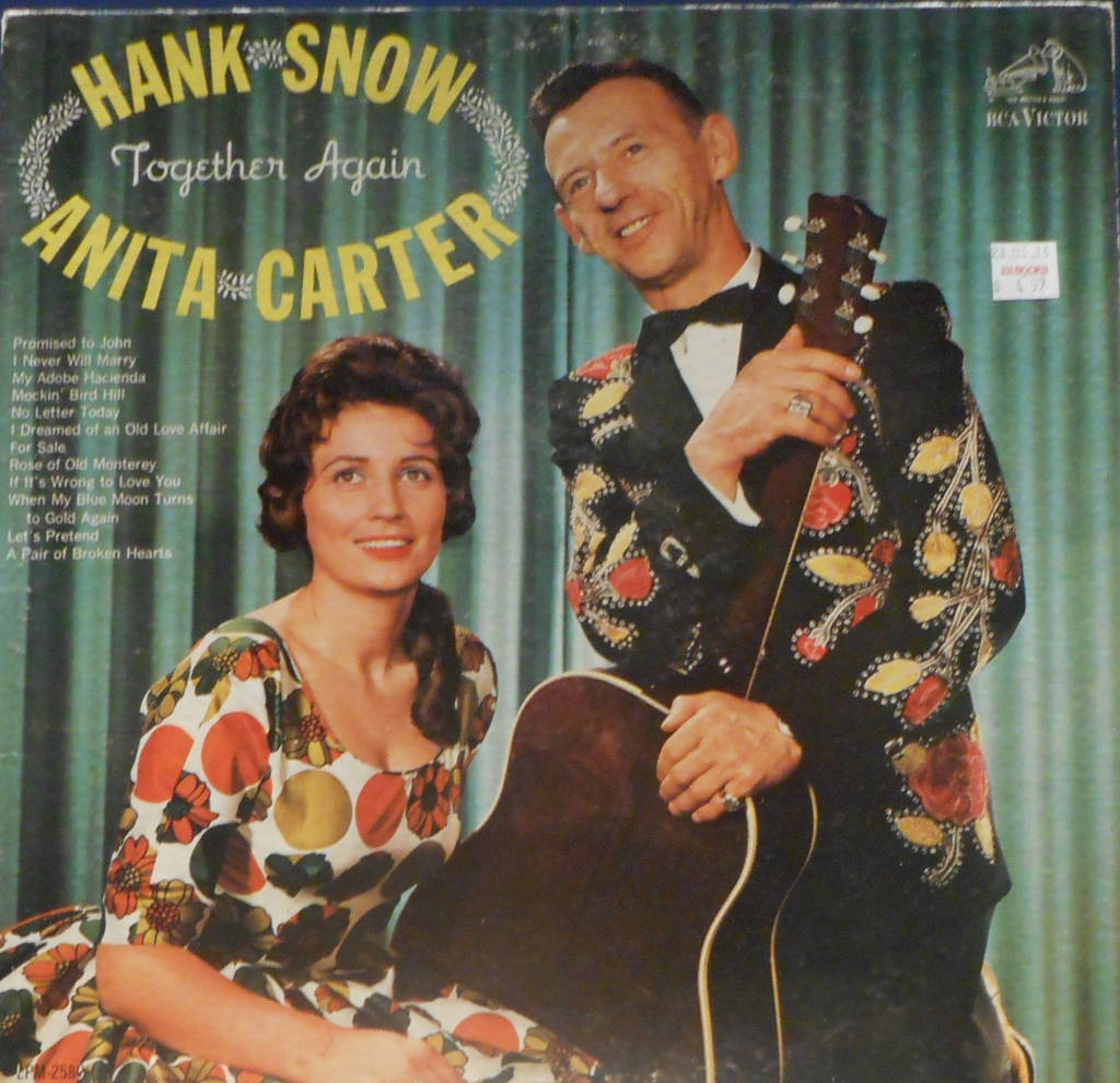 Iconic Country Singers Hank Snow and Anita Carter Performing Together Wallpaper