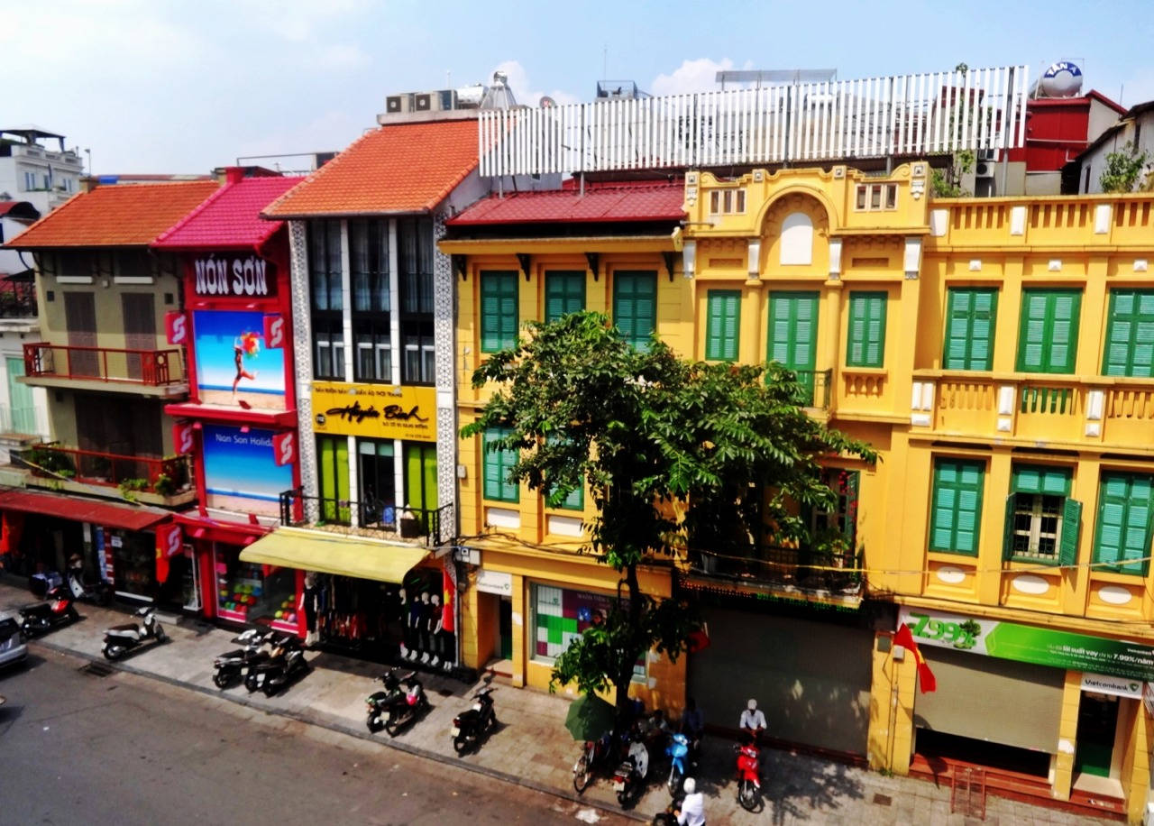 Vibrant Multicolored Buildings in Hanoi Wallpaper