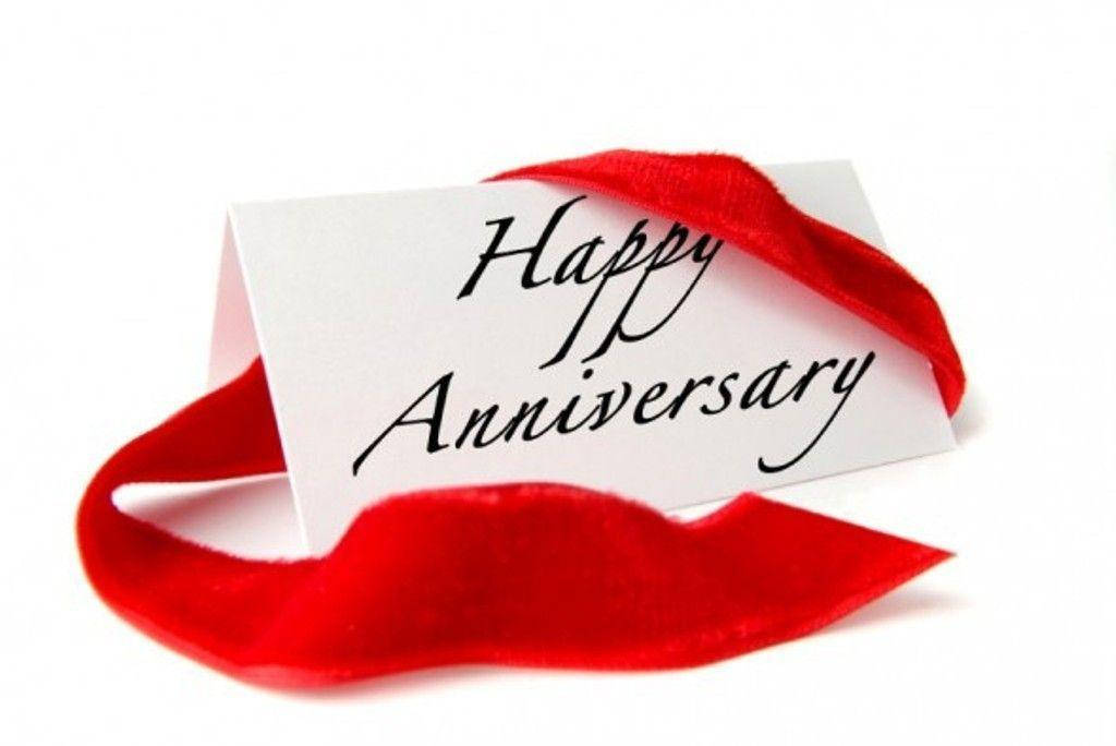 Happy Anniversary Signage And Red Ribbon Wallpaper