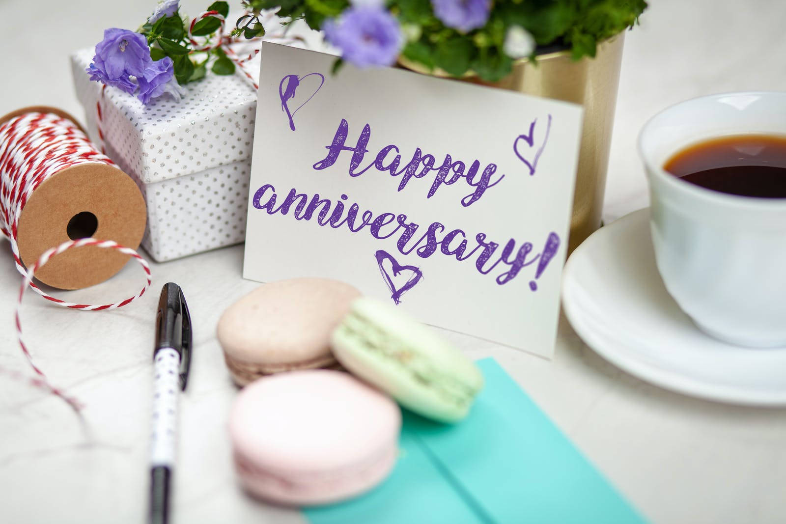 Happy Anniversary Signage With Macaroons Wallpaper