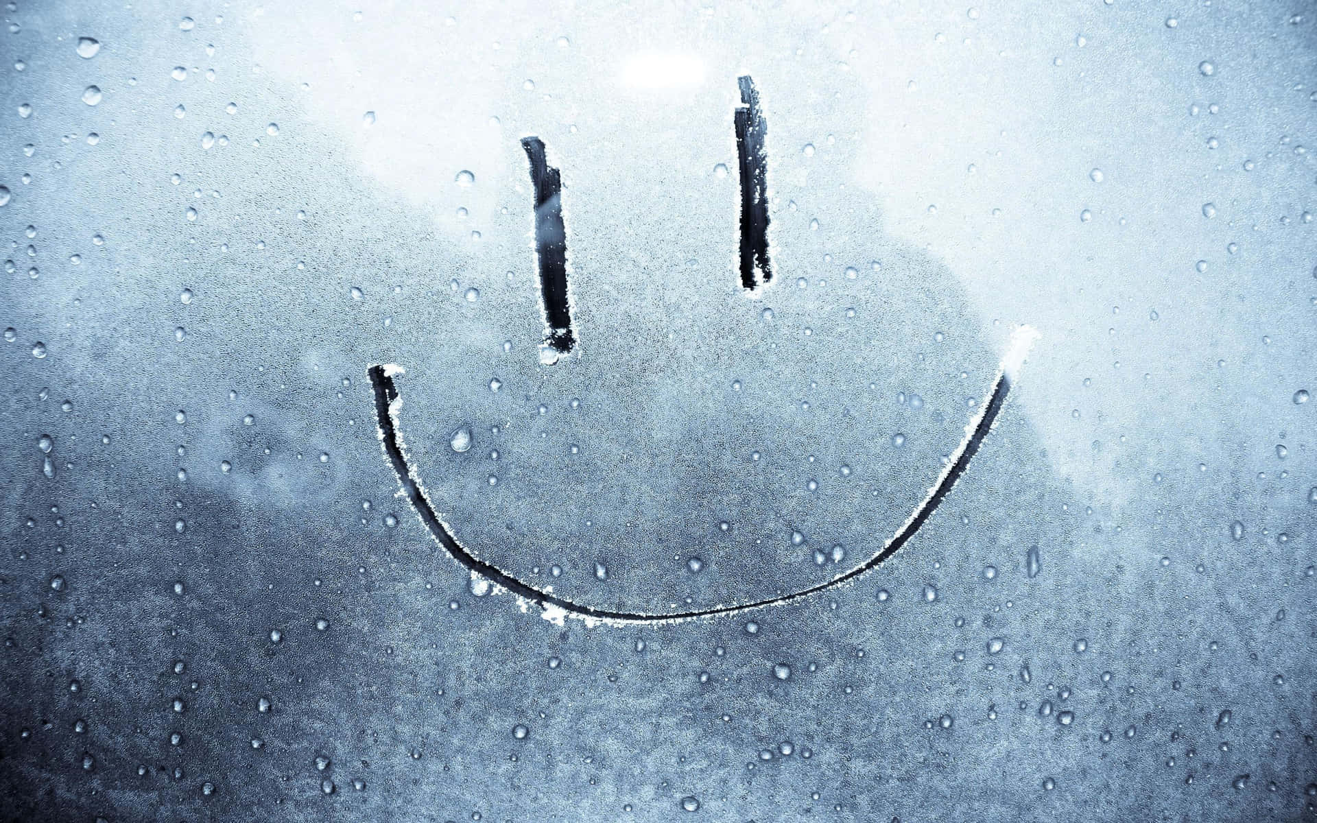 A Smiley Face Drawn On A Window