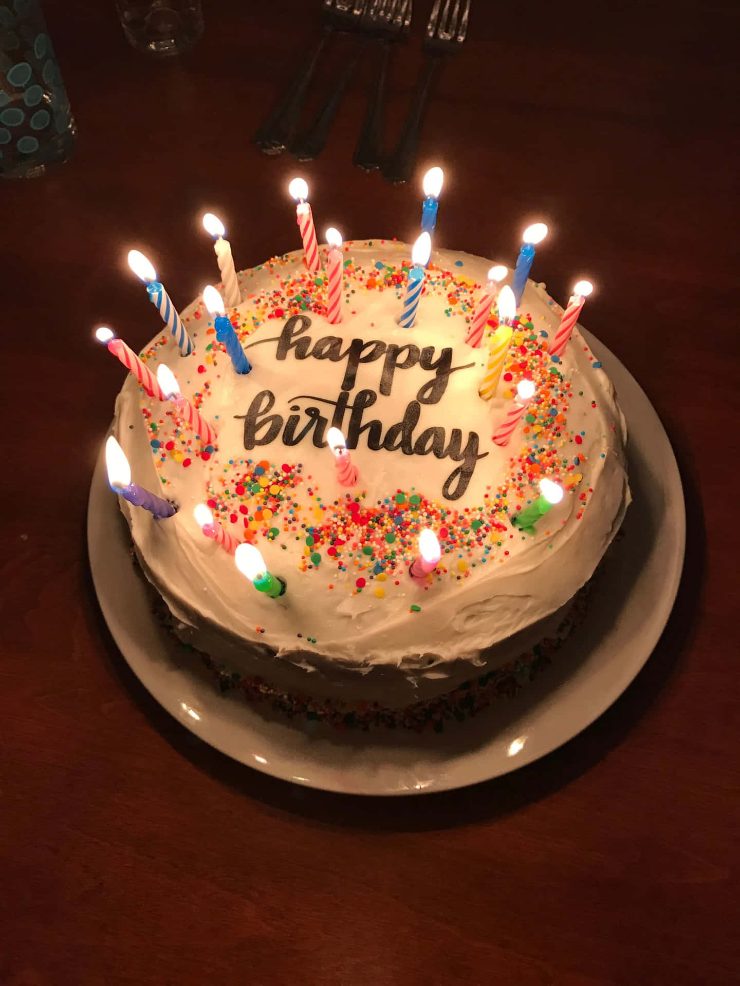Delicious Happy Birthday Cake with Glowing Candles