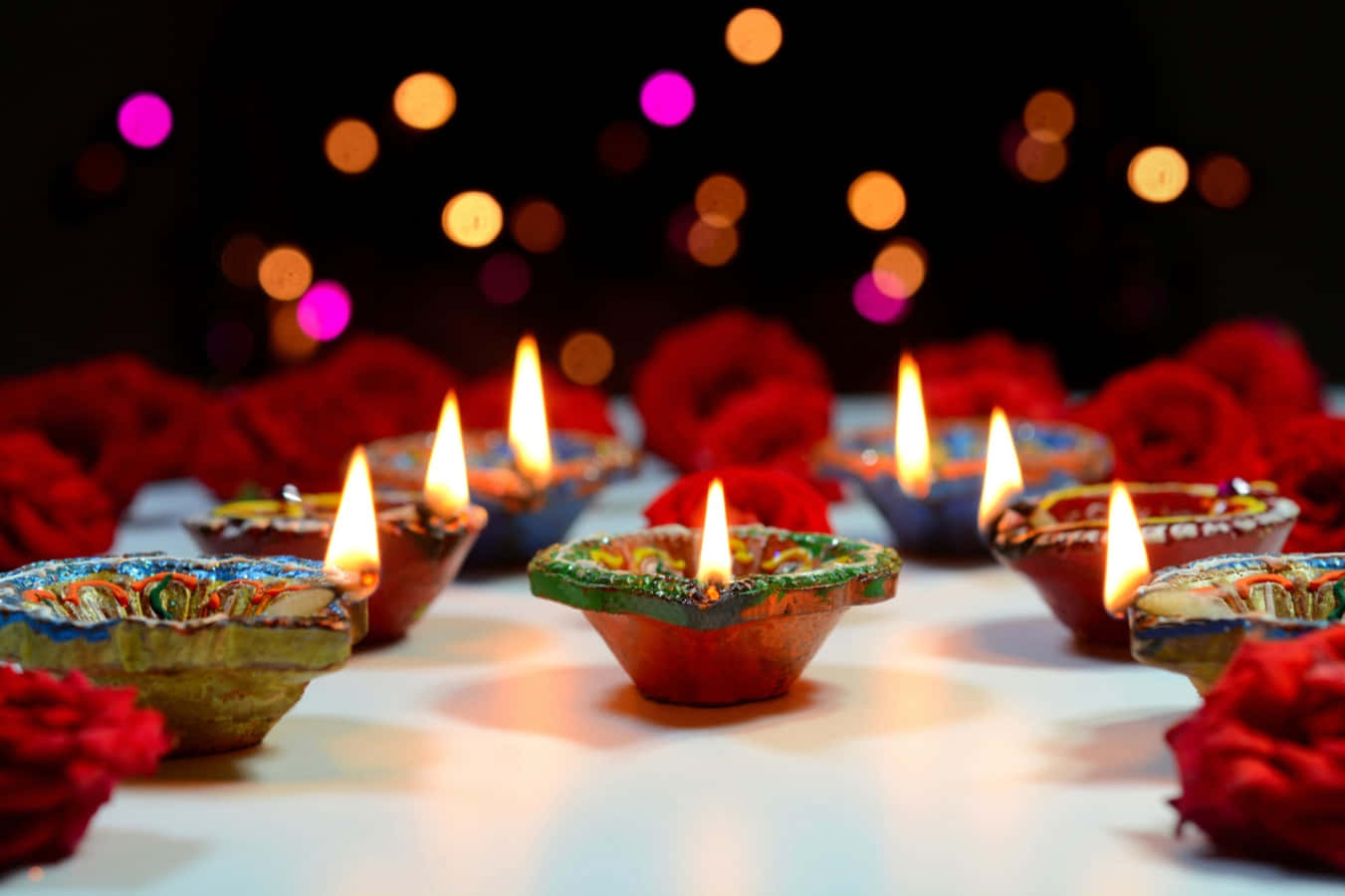 Diwali Diyas With Candles And Roses