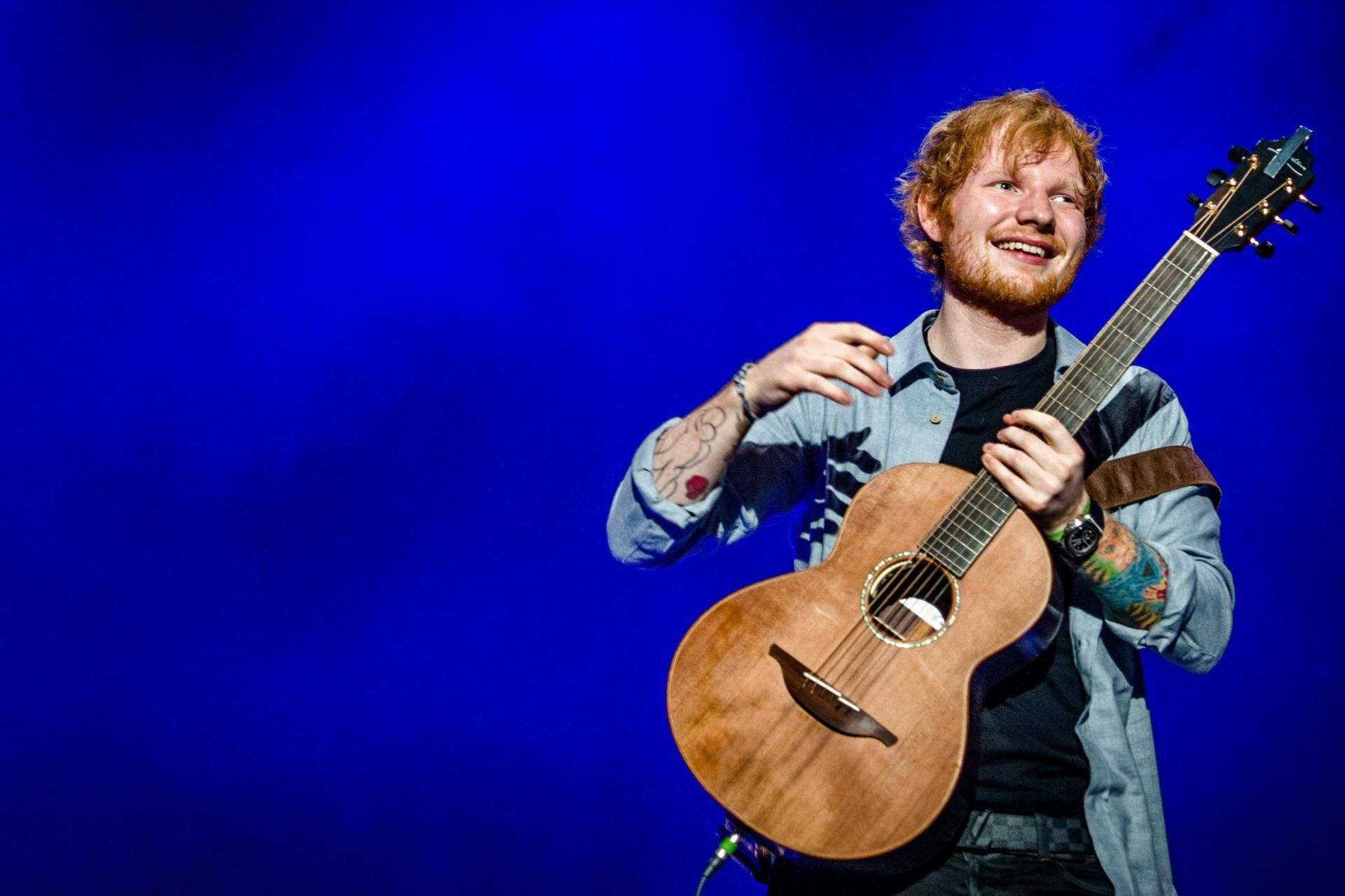 Ed Sheeran smiling brightly Wallpaper
