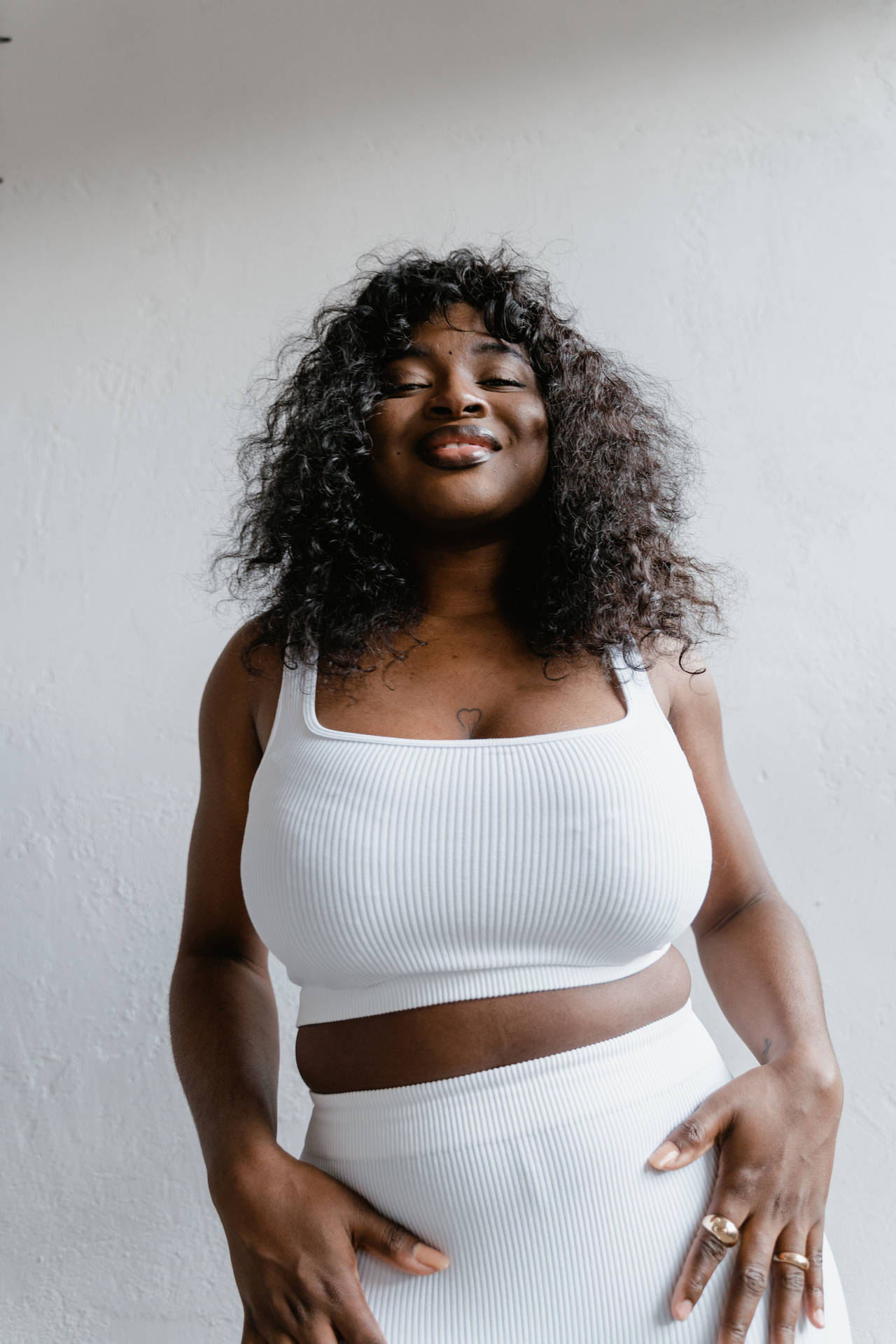 Happy Plus Size Woman Embracing Her Body Wallpaper