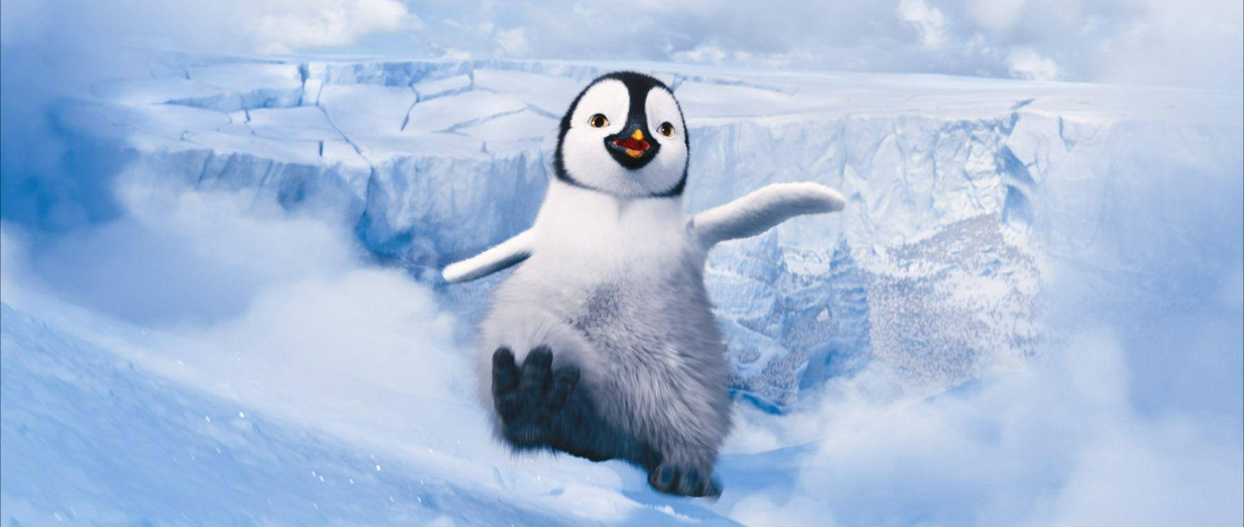 a penguin is running on top of a snowy mountain Wallpaper