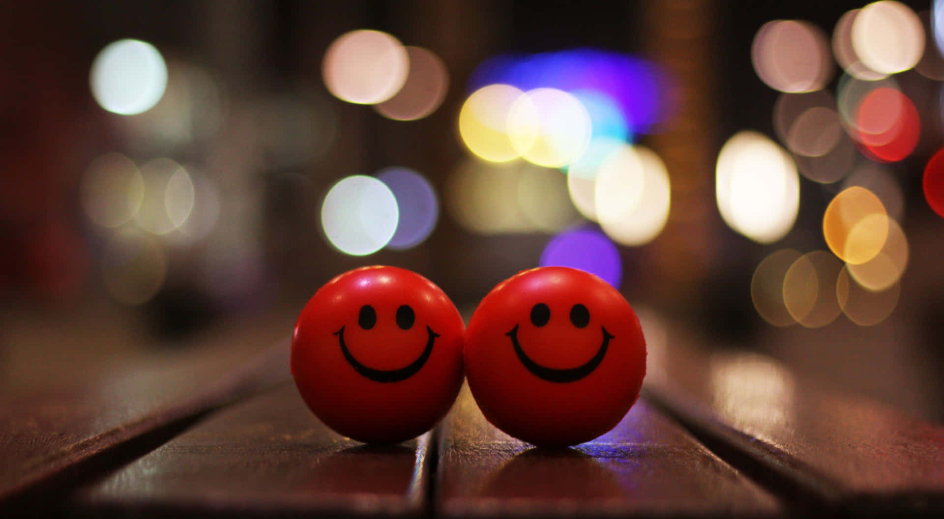 Two Red Balls On A Wooden Bench