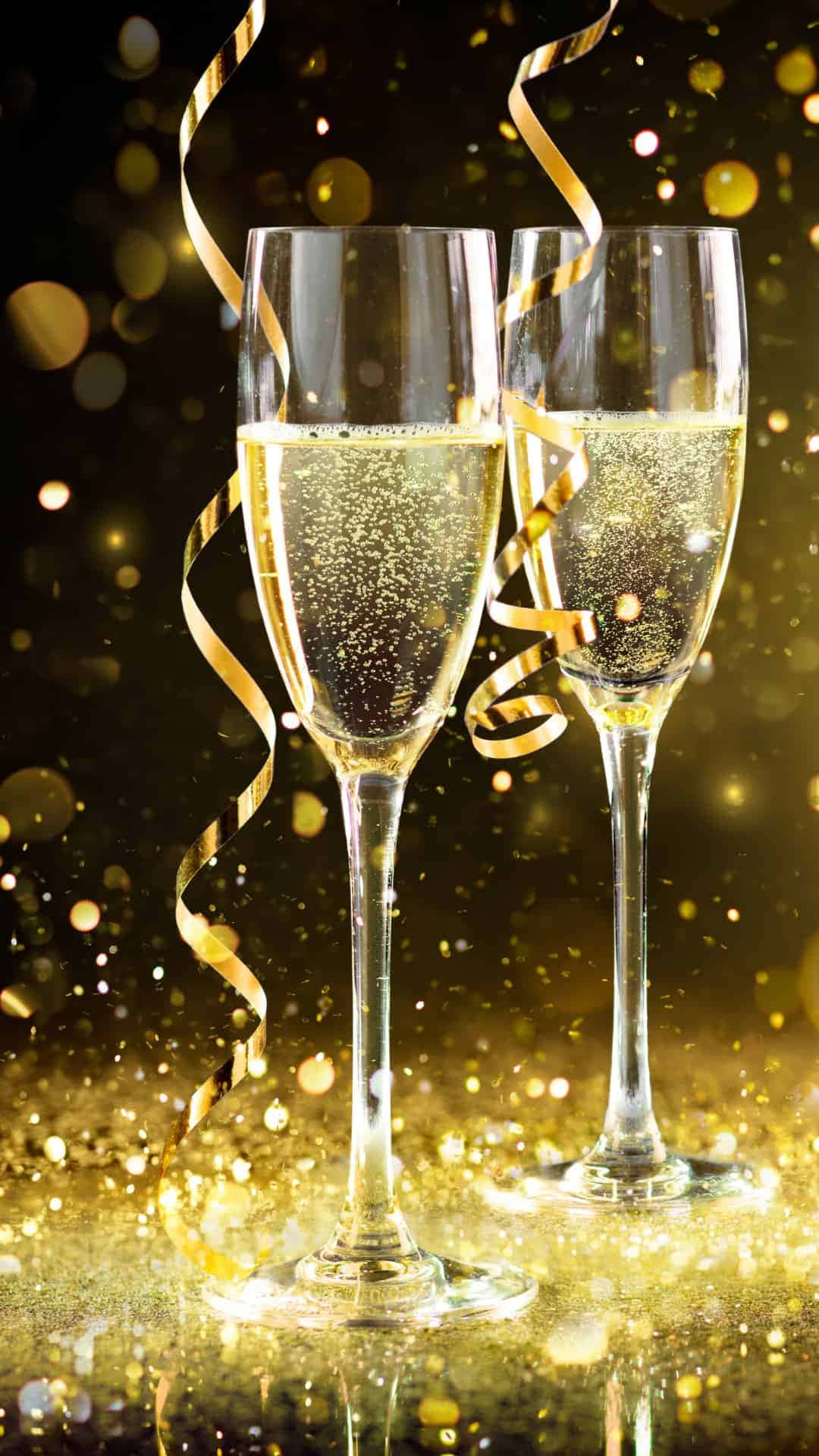 Two Glasses Of Champagne With Gold Confetti Wallpaper