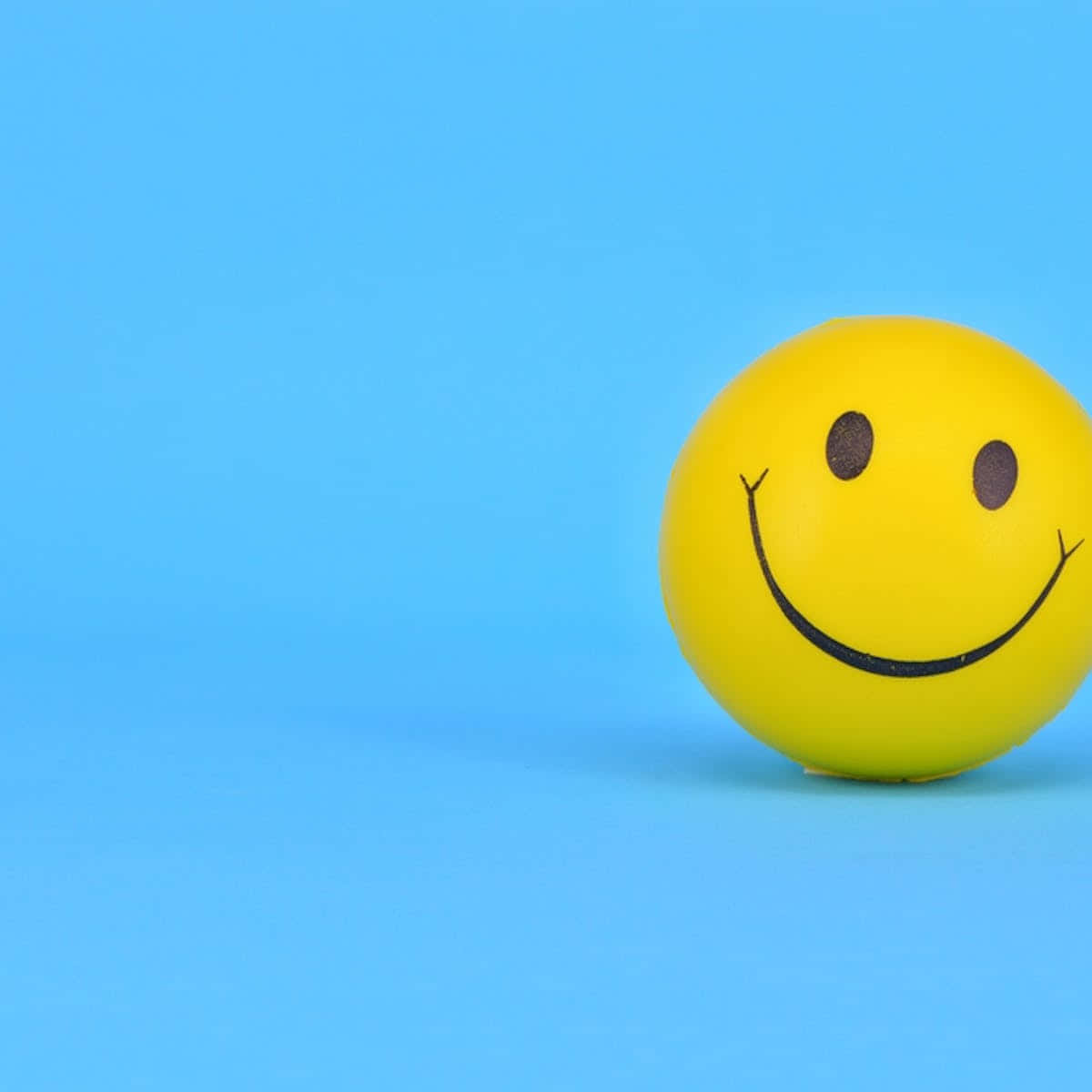 Happy Emoji On Blue Picture