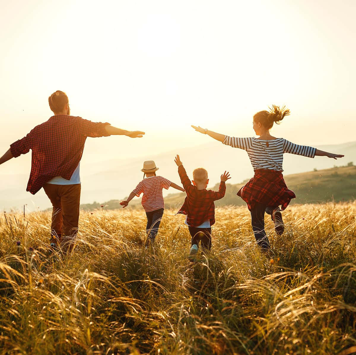 Happy Family Running In Grass Field Picture