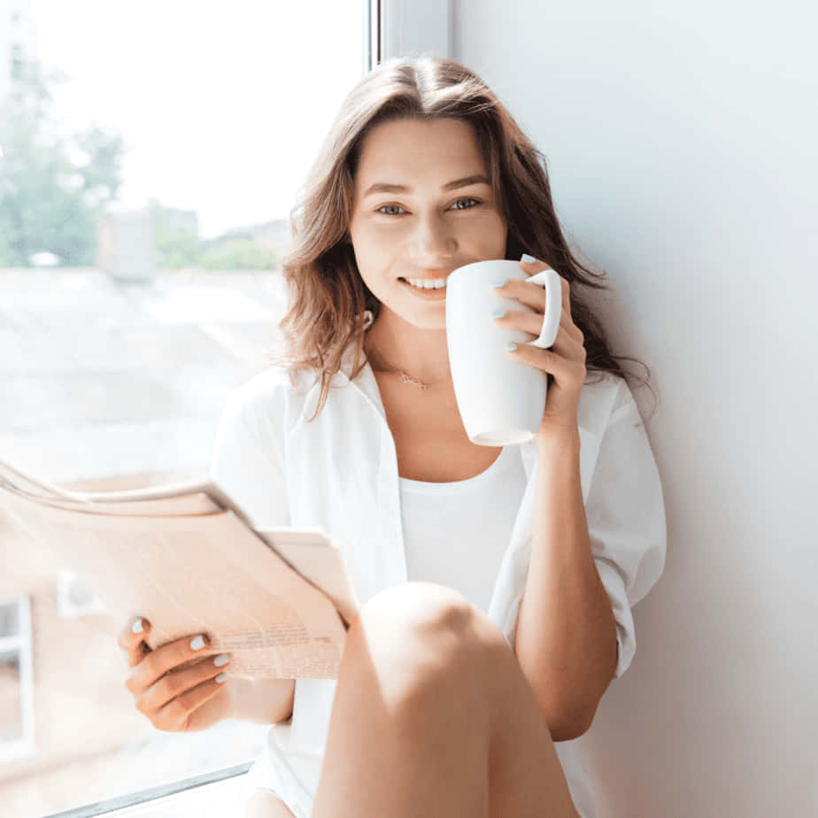 Happy Woman Holding A Cup Picture