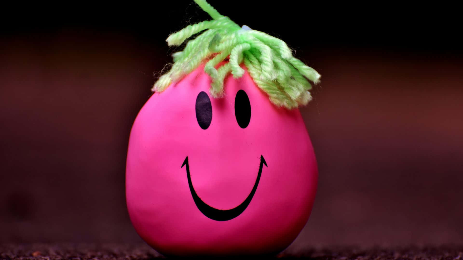 Happy Pink Smiley Ball With Green Hair Wallpaper